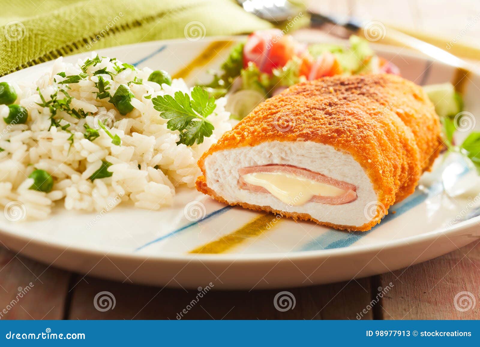 cordon bleu chicken with rice and parsley