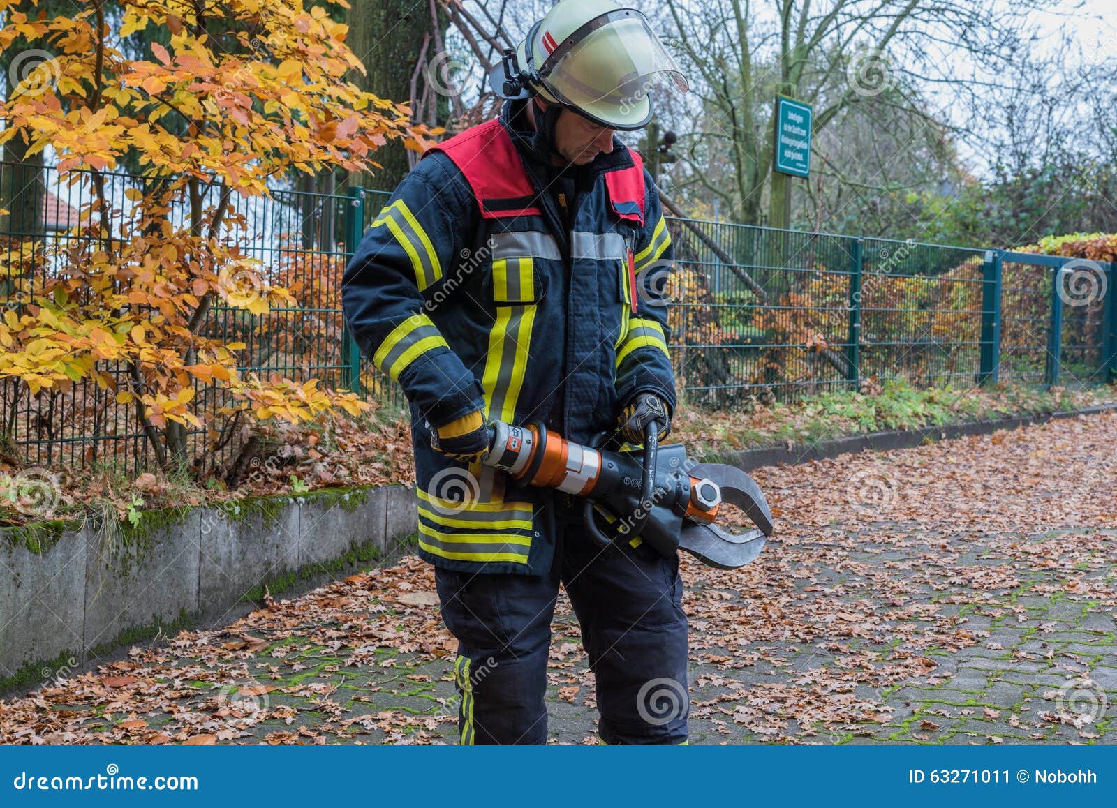 Firefighter in Action with Emergency Tools Stock Image Image of
