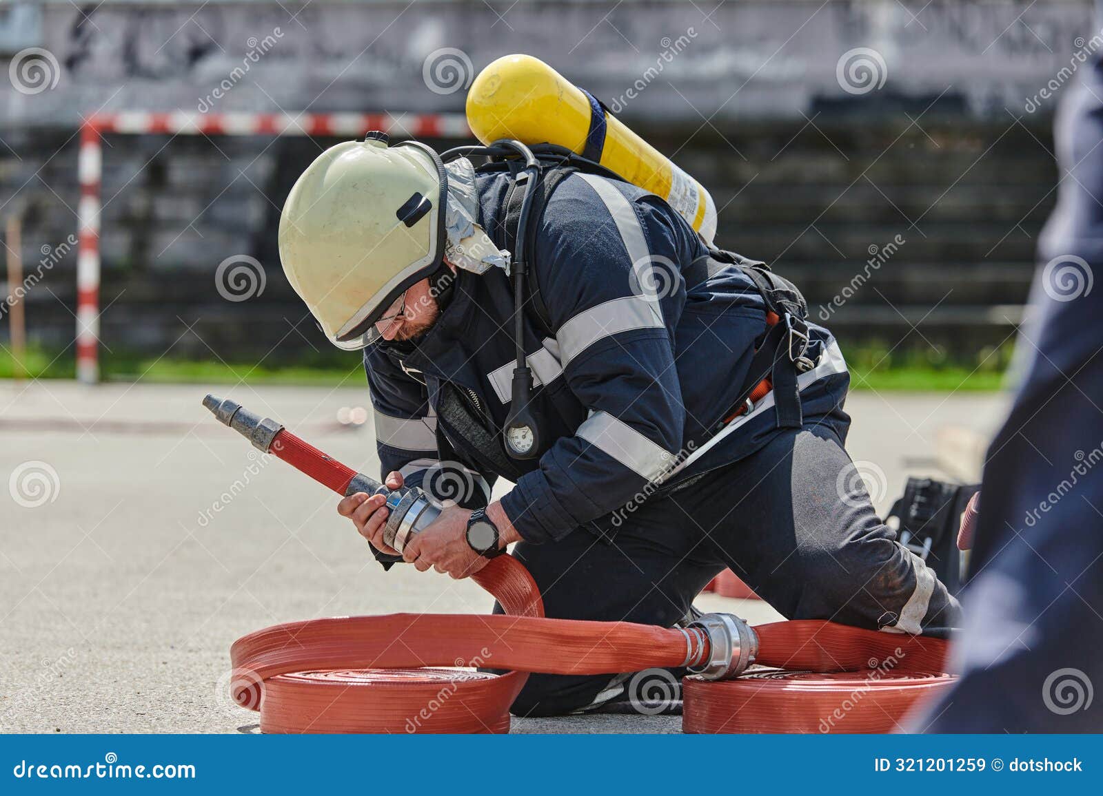 a firefighter dons the essential components of their professional gear, embodying resilience, commitment, and readiness