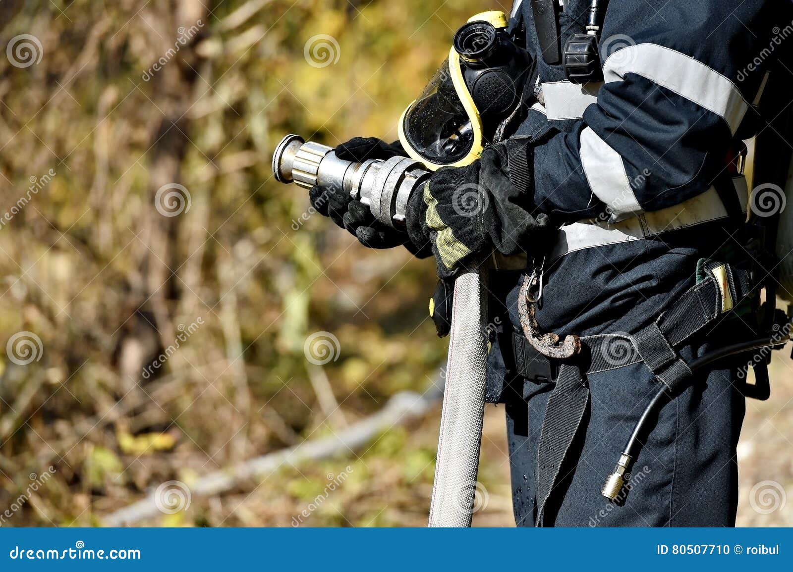 Firefighter Holding Water Hose Stock Photo Image of firefighting