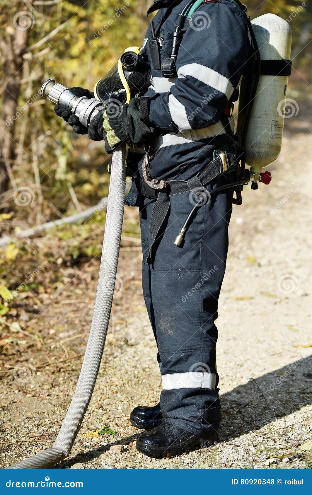 Firefighter Holding Water Hose Stock Photo Image of uniform, safety