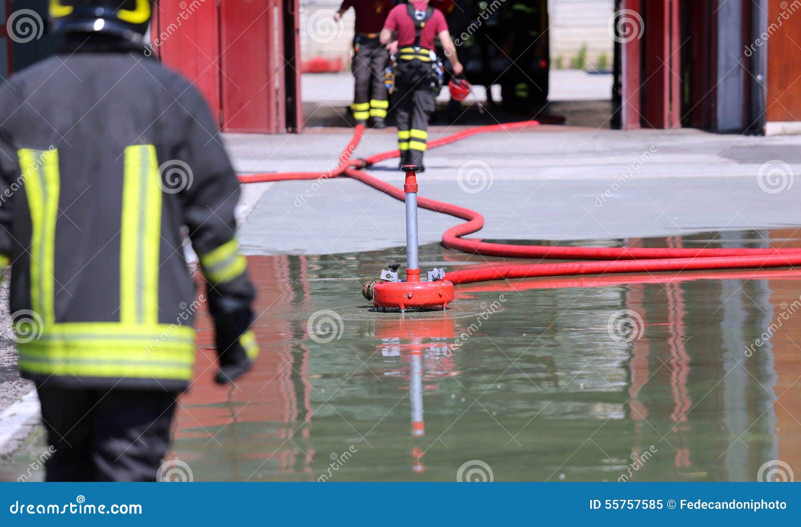 Firefighter Positions a Powerful Fire Hydrant during the Exercises