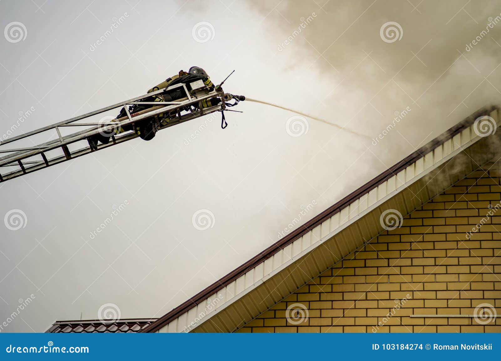 A Firefighter Puts Out a Burning Building with Height Extension Ladders
