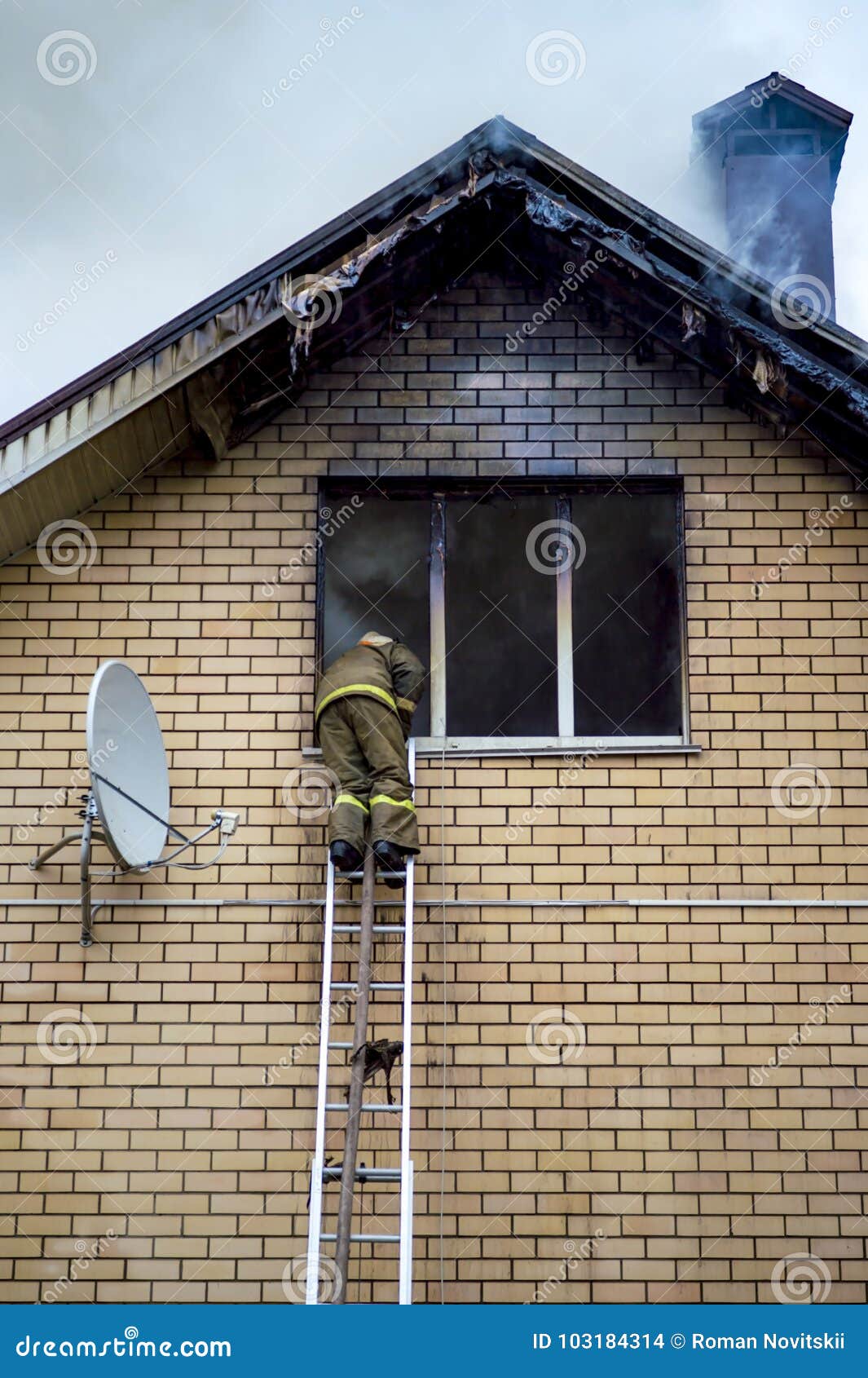 A Firefighter Puts Out a Burning Building with Height Extension Ladders