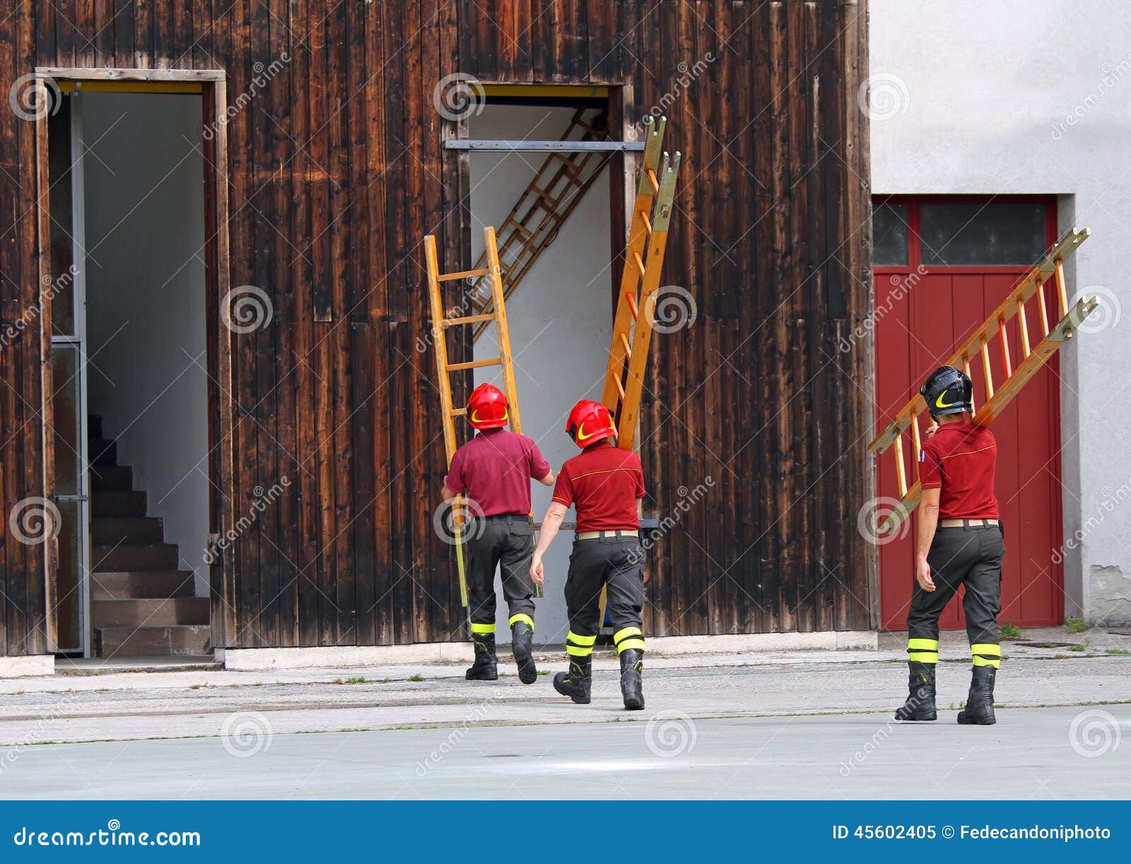 Firefighters during the Fire Drill Mount a Ladder Editorial Image