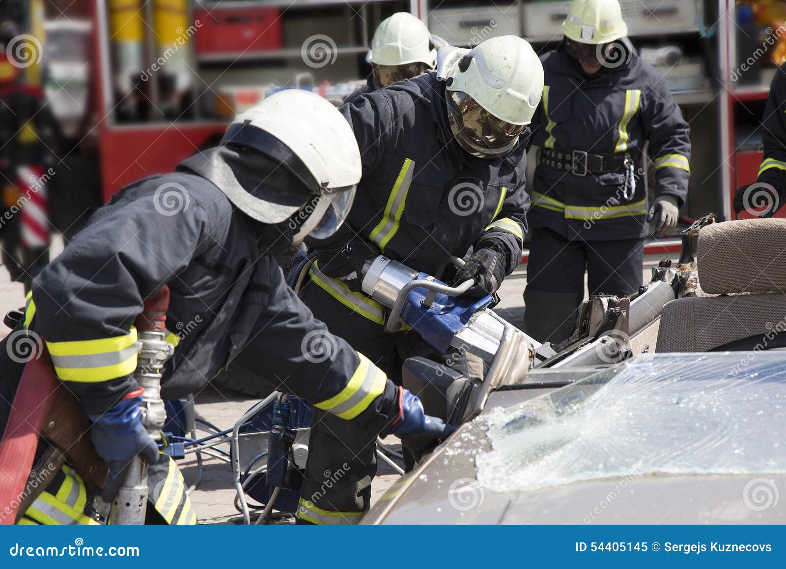 Firefighters with the Pneumatic Shears Open the Car Doors Stock Image