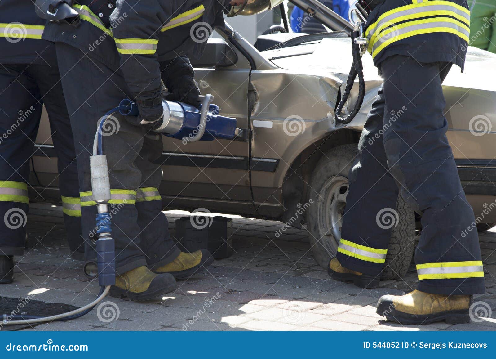 Firefighters with the Pneumatic Shears Open the Car Doors Stock Photo