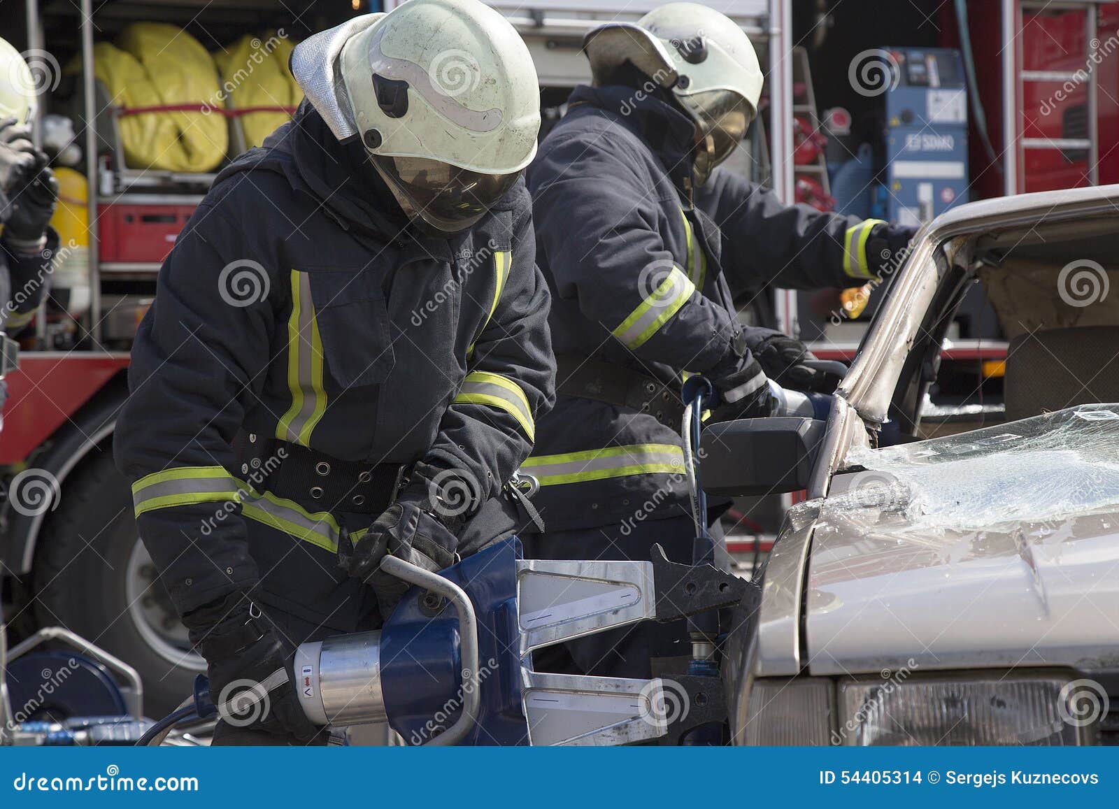 Firefighters with the Pneumatic Shears Open the Car Doors Stock Photo