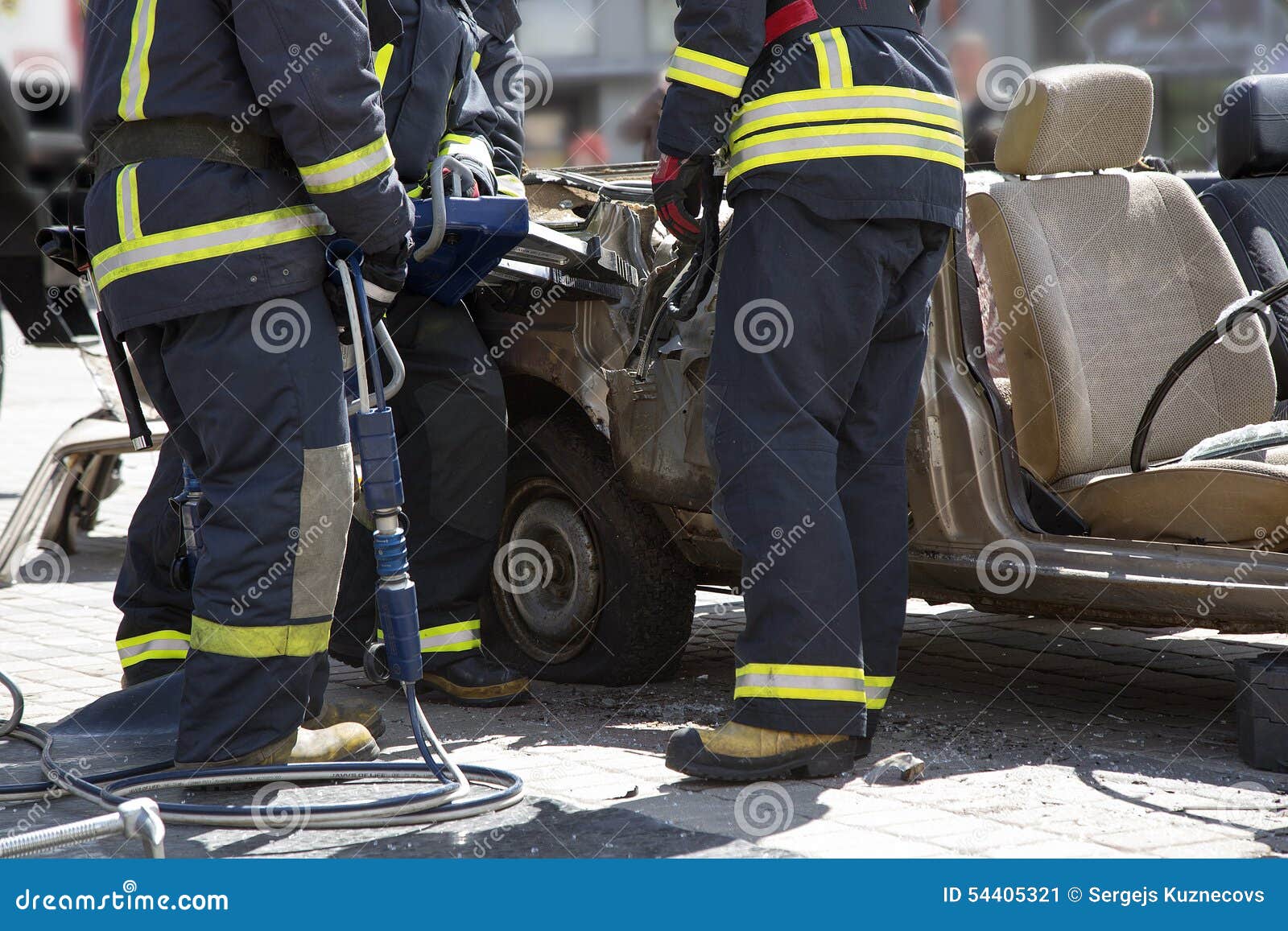 Firefighters with the Pneumatic Shears Open the Car Doors Stock Image