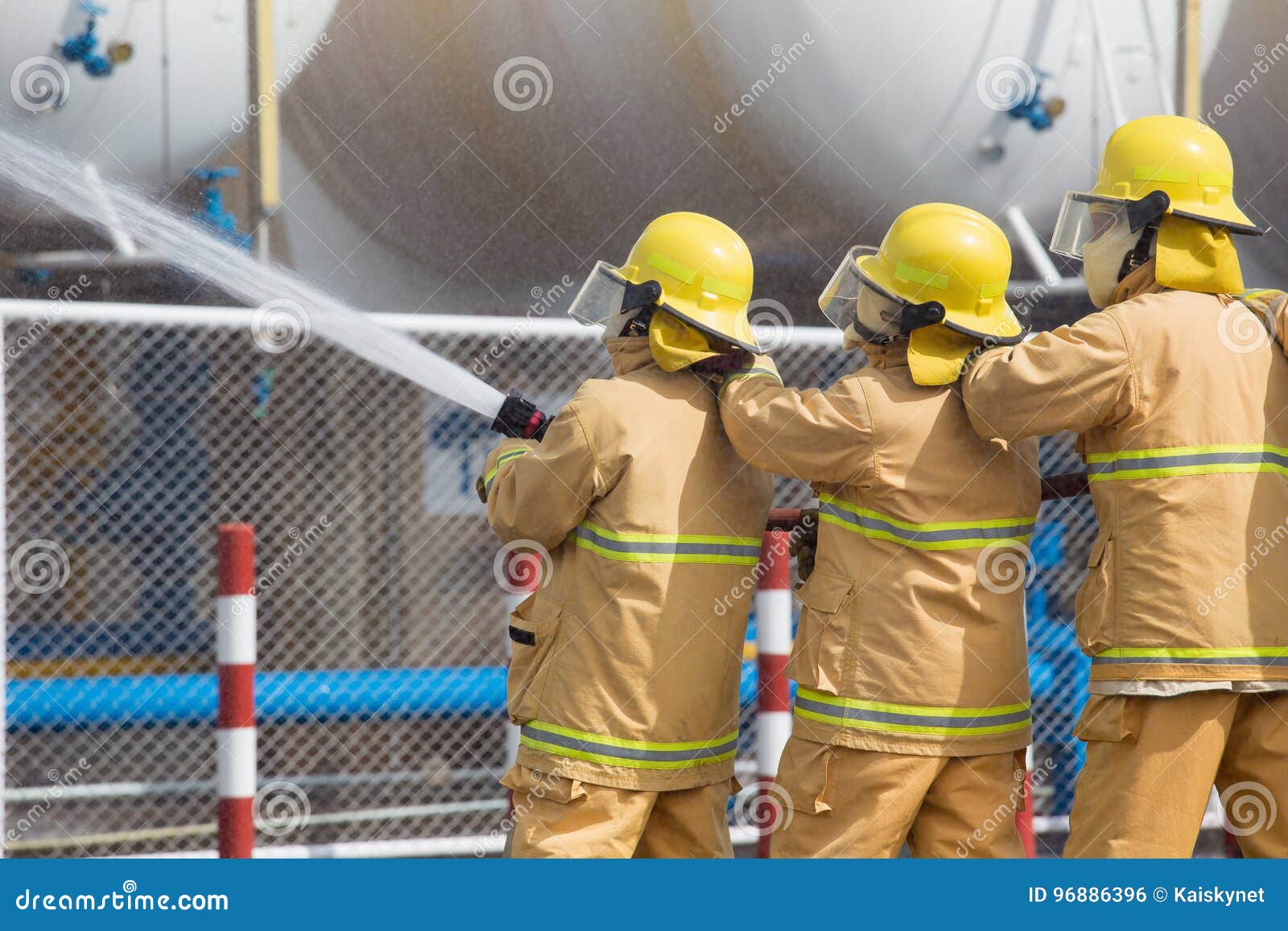 Firefighters Spray Water in LPG Gas Tanks, Fire Extinguishers Ca Stock