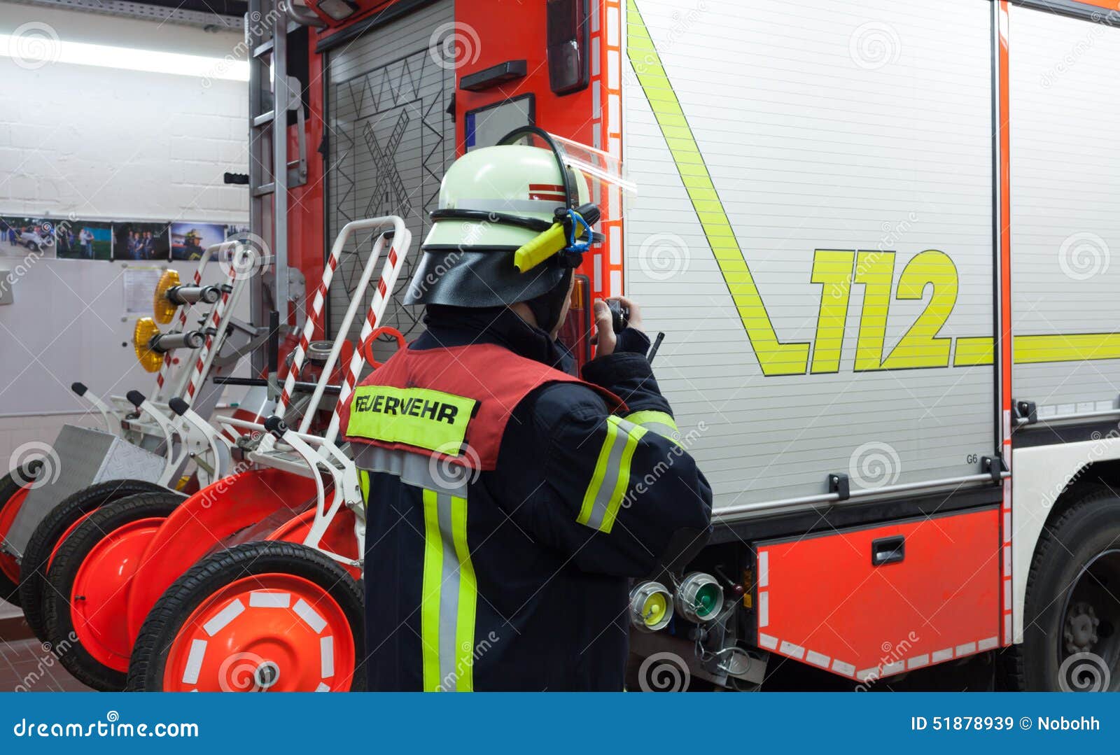 fireman in a fire department fire truck spark with radios set