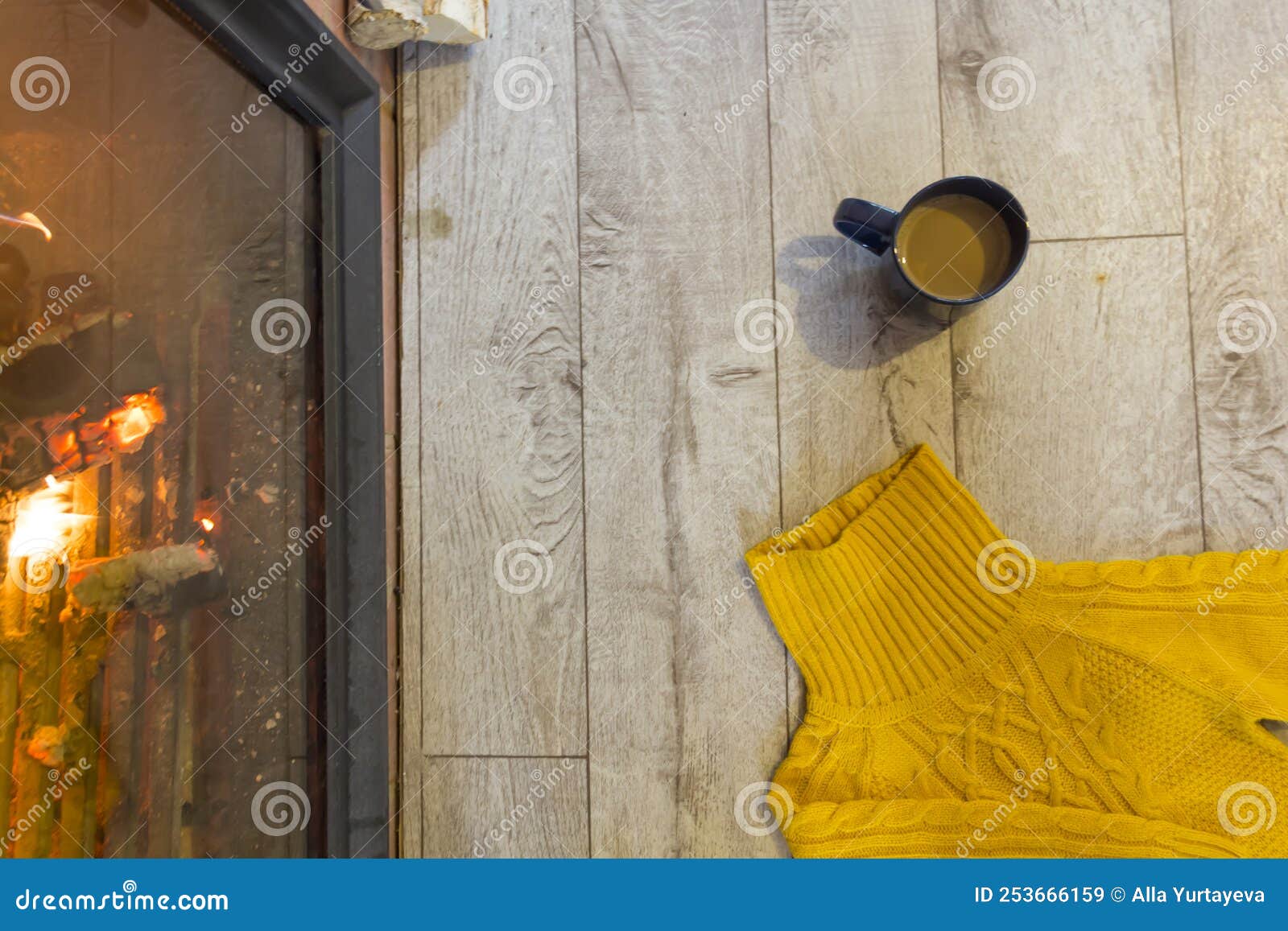 Fireplace with a Blazing Fire in the Interior of a Wooden House
