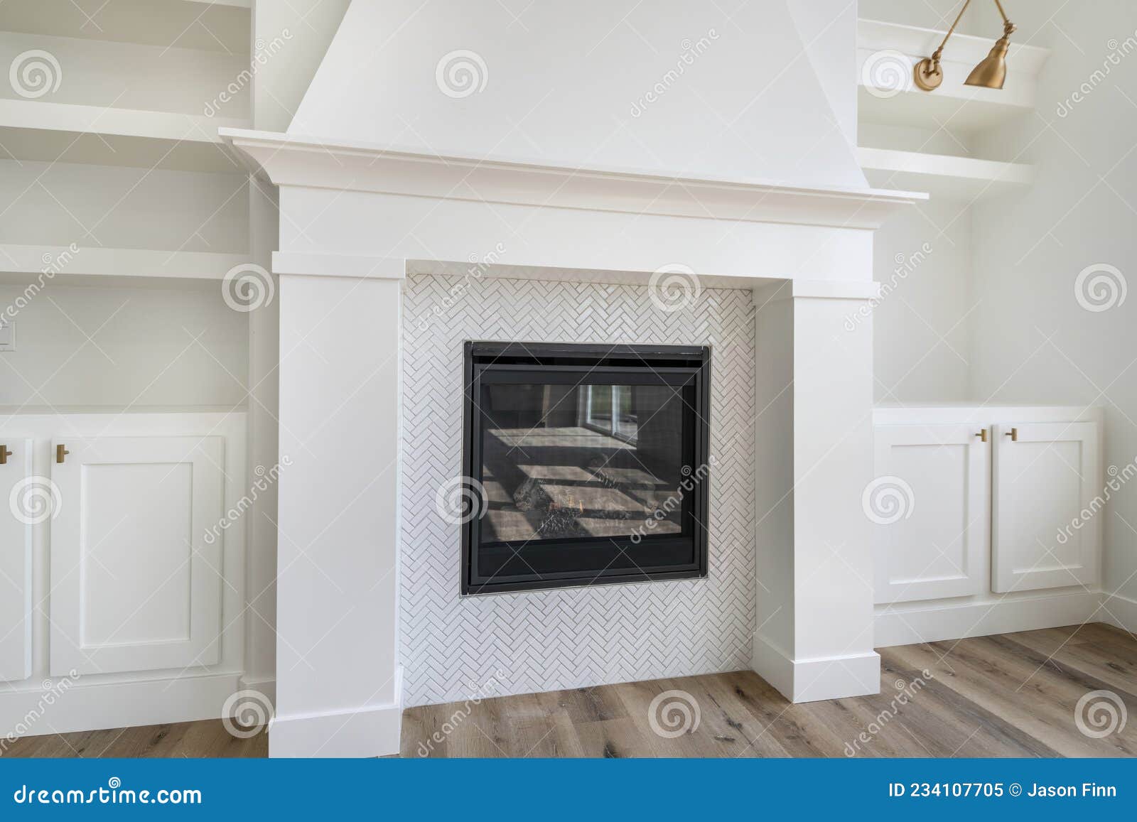 fireplace with white tiles in herringbone pattern surround