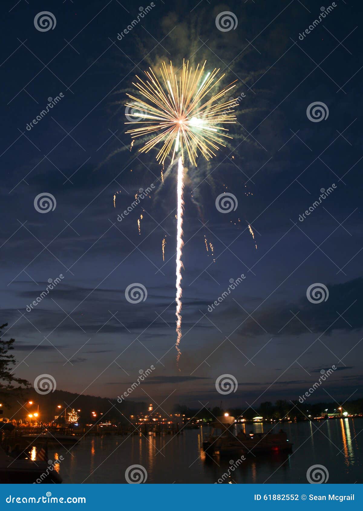 Firework over the lake. stock photo. Image of long, fire 61882552