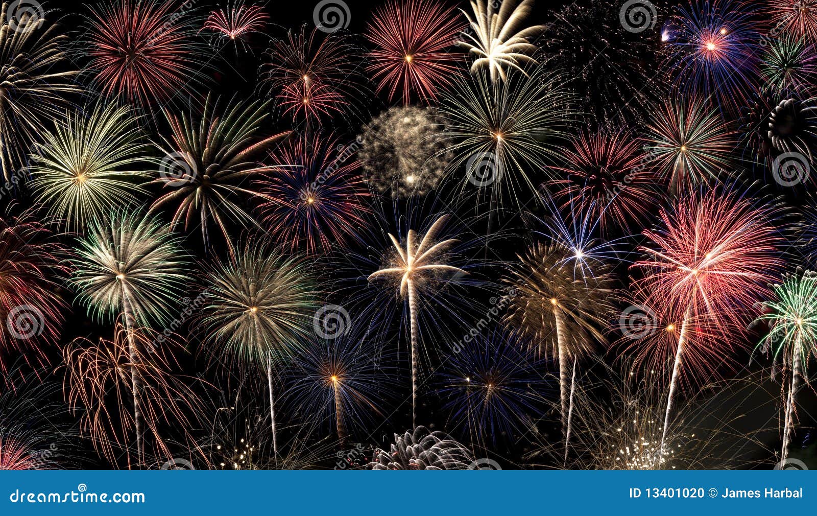 Fireworks Background. A slew of different colored fireworks bursts against a black background