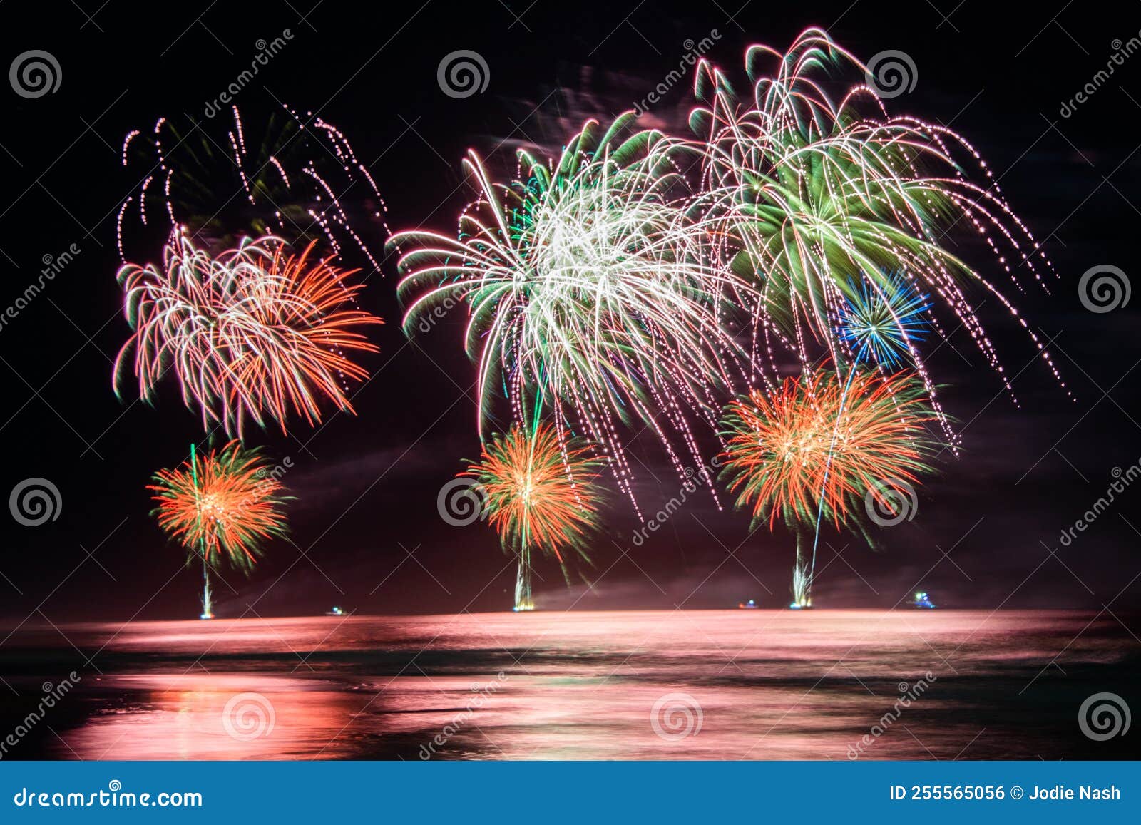 Fireworks Exploding Over the Ocean at Night Stock Photo Image of