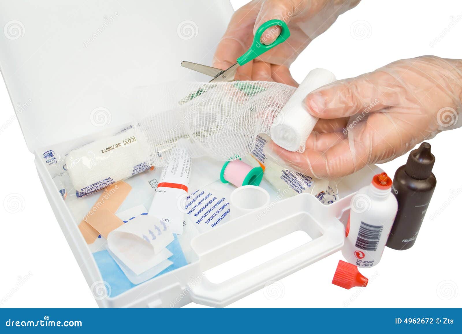 first-aid kit and hands with gloves