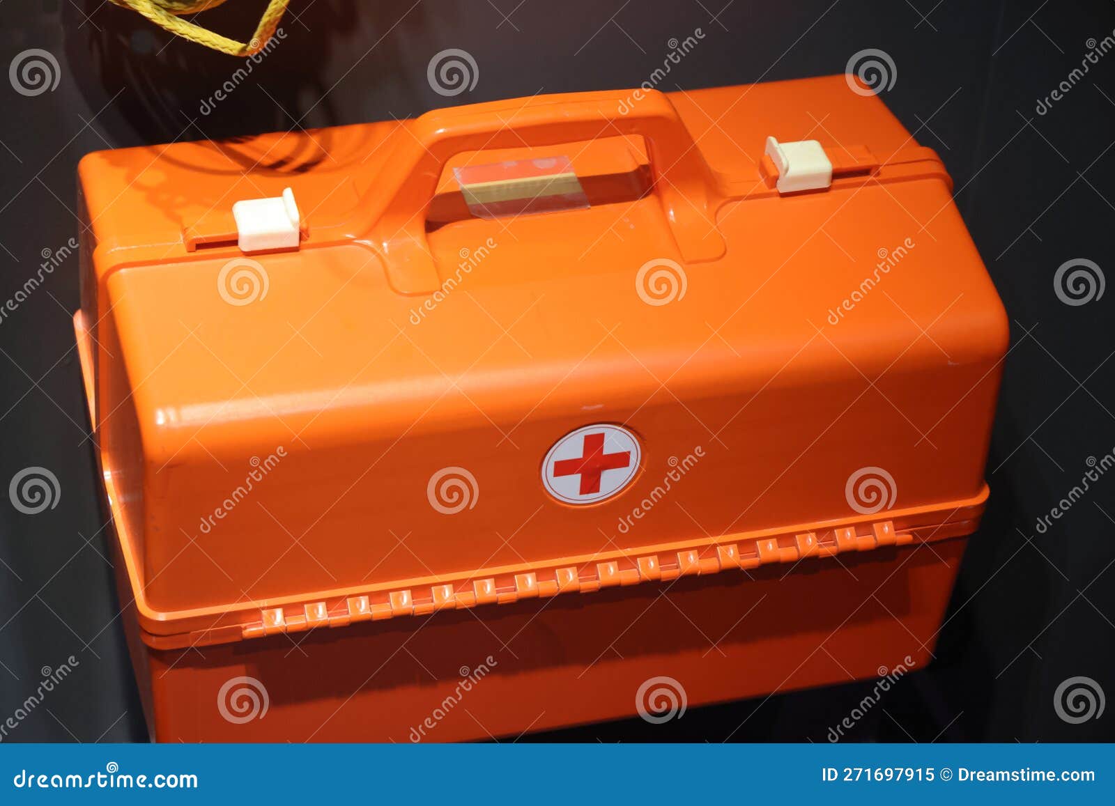 First Aid Kit, Orange Container with a Cross. Portable Basic First Aid