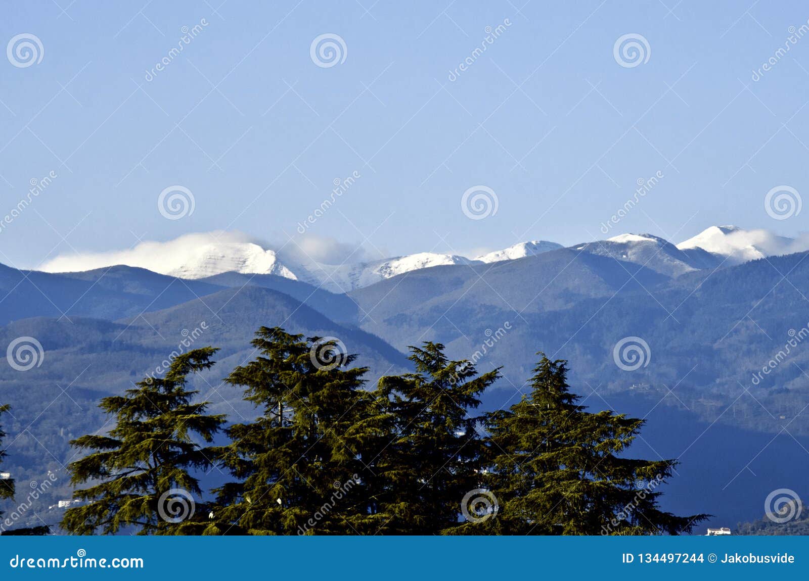 first snow on montagna pistoiese ridge seen from pistoia