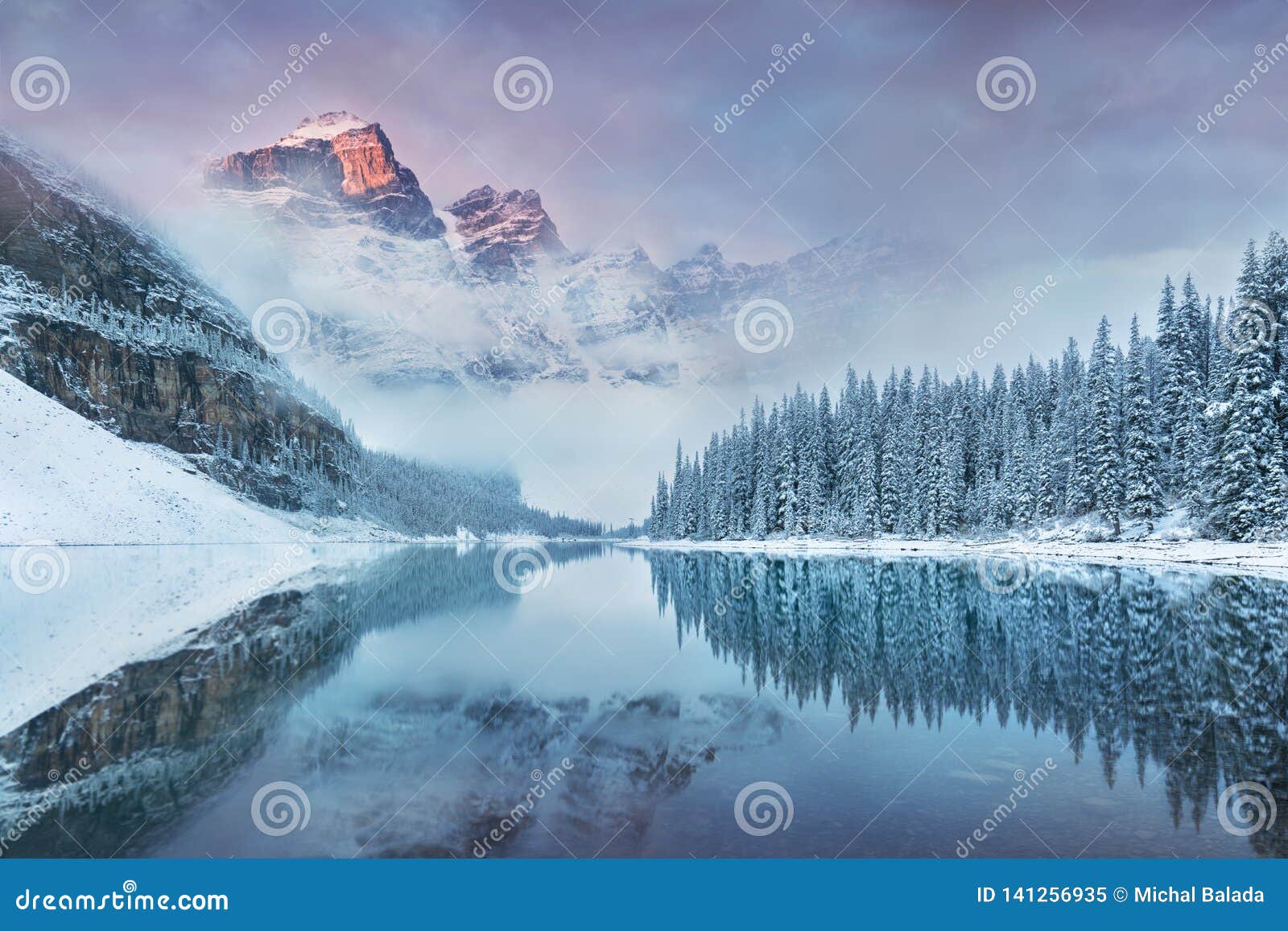 first snow morning at moraine lake in banff national park alberta canada. snow-covered winter mountain lake in a winter atmosphere