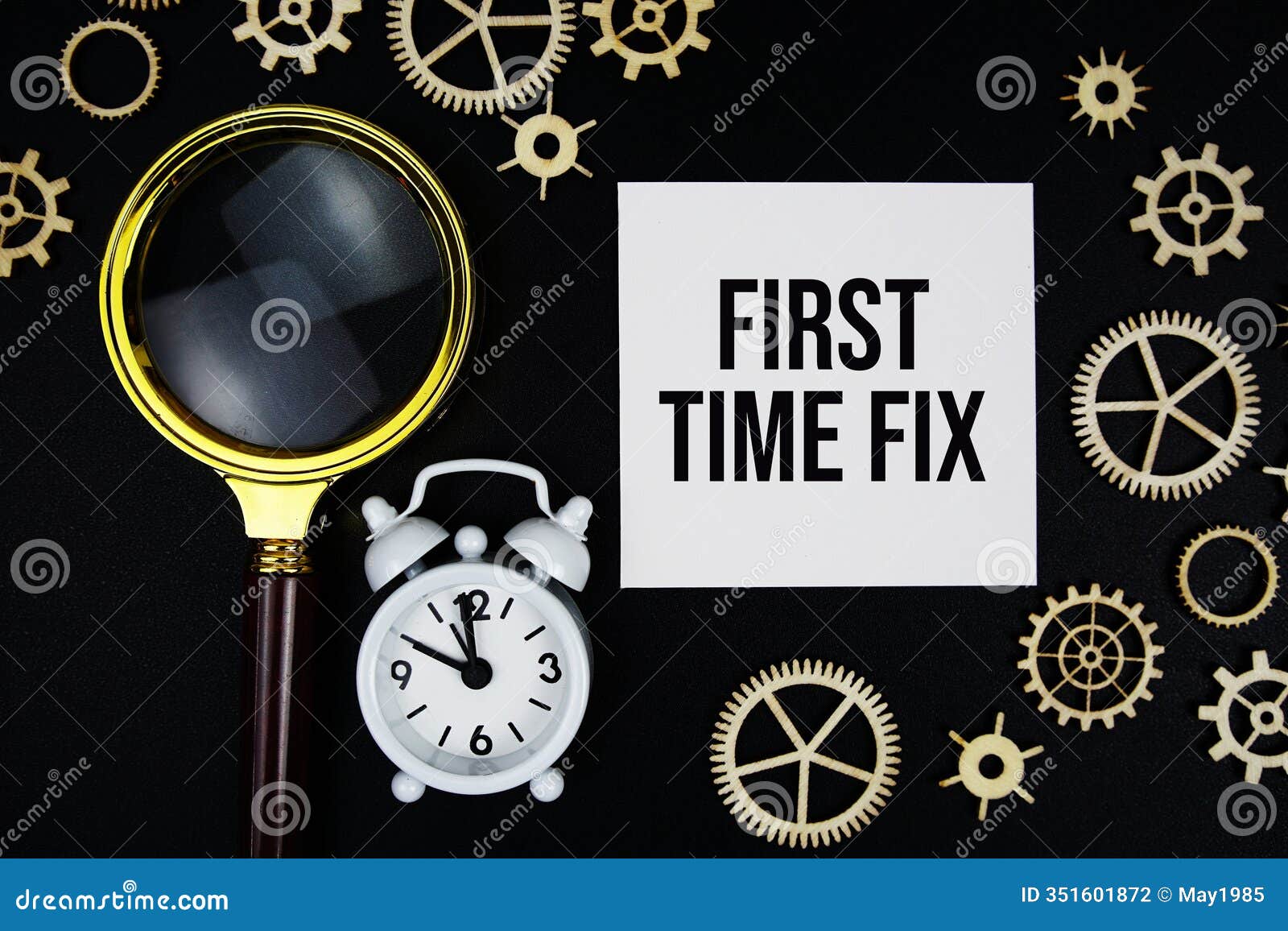 first time fix text message on sticky note with magnifying glass and alarm clock on black background