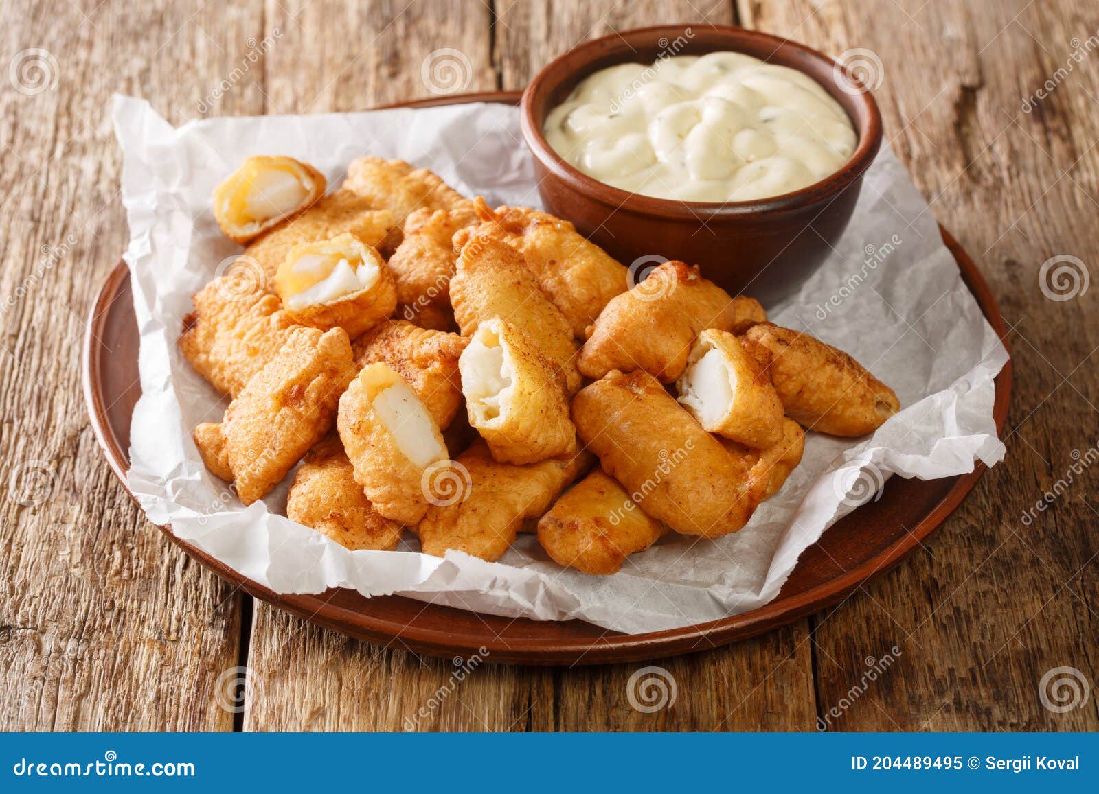 Fish Appetizer Consisting of Deepfried Cod Pieces and Served with a
