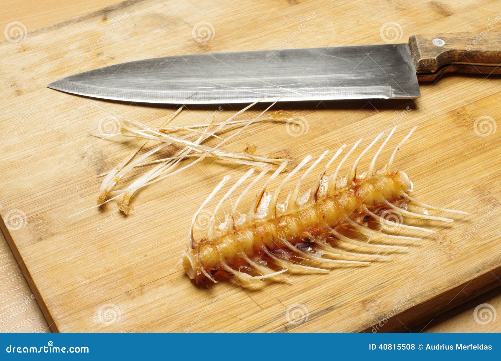 Fish Bones, Skeleton And Knife On The Cutting Table Stock Photo Image