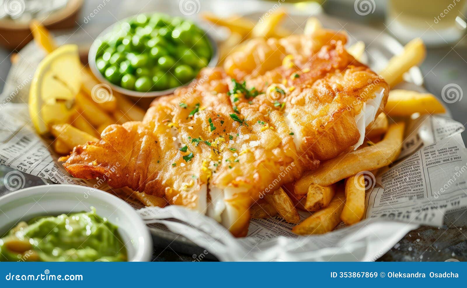 fish and chips with peas on newspaper