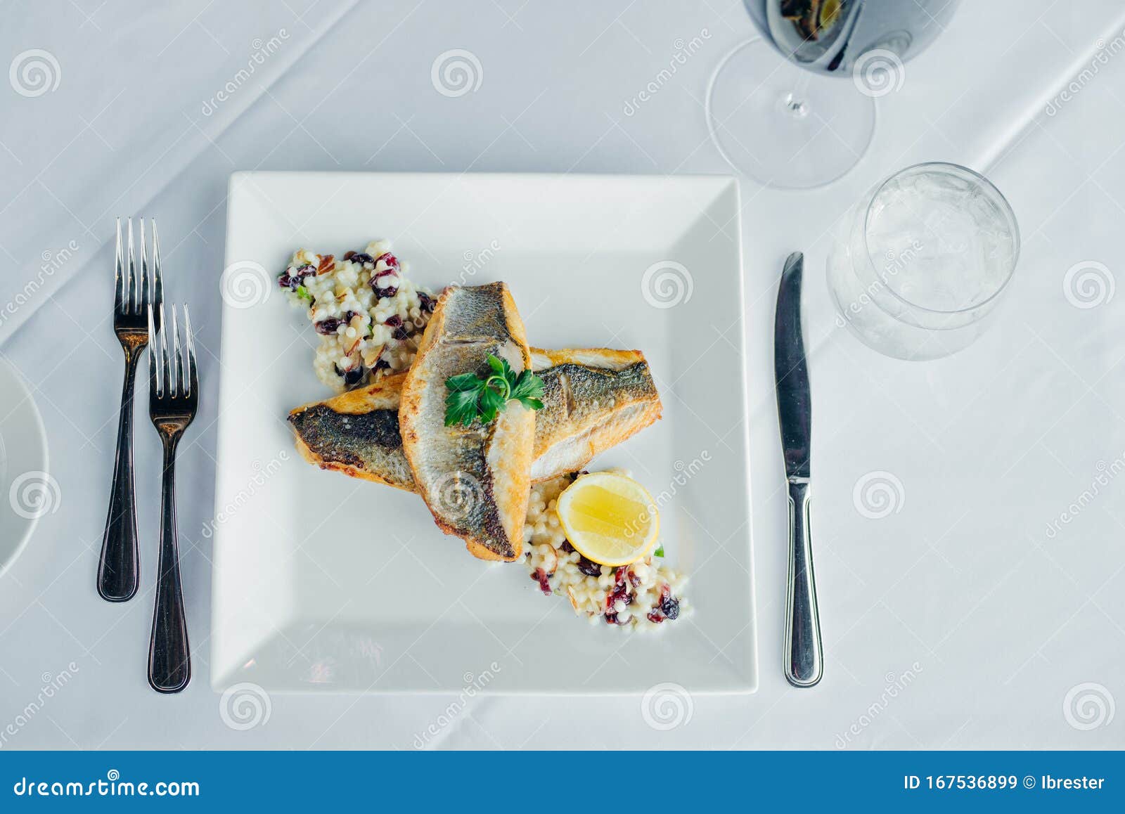 fish dish - fish fillet and vegetables in restaurante