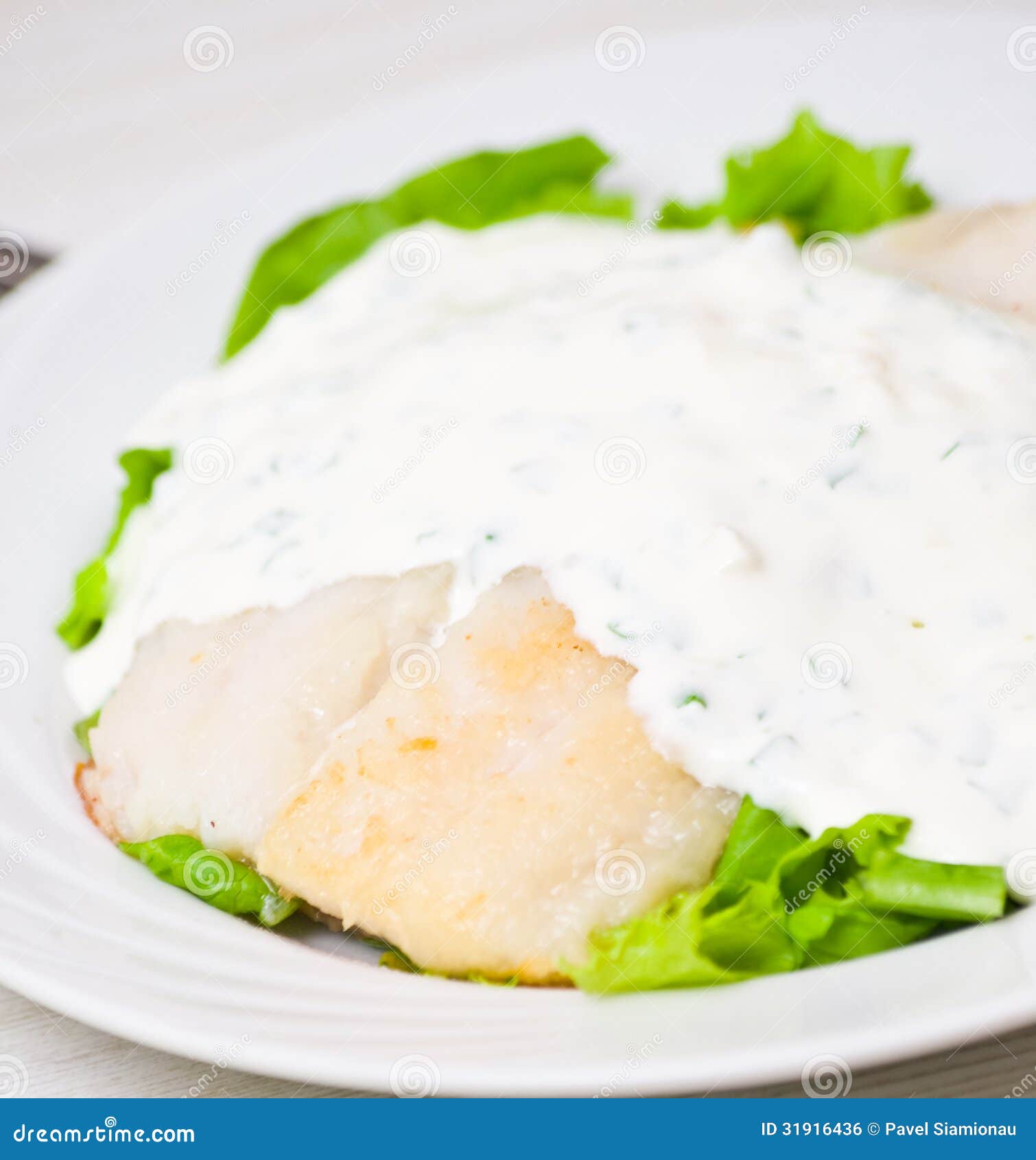 Fish fillet with sauce stock photo. Image of portion 31916436