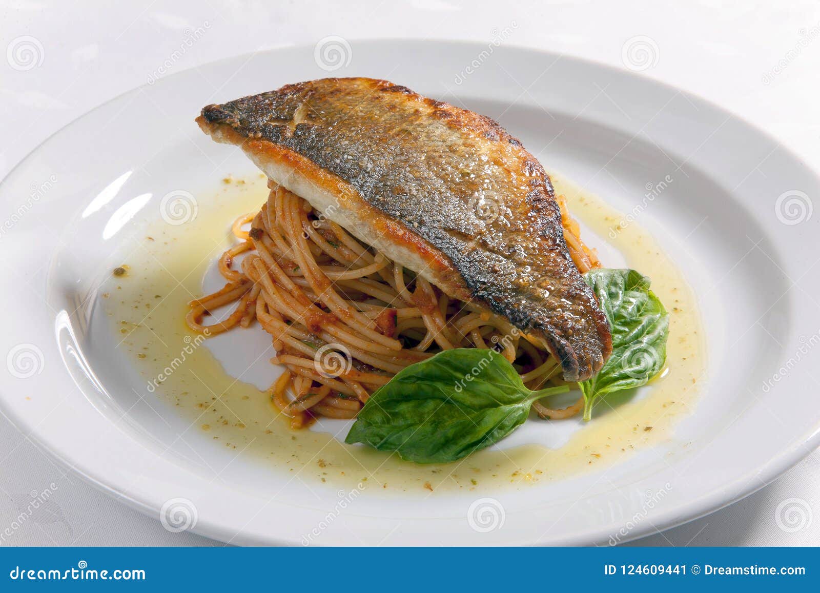 Fish fillet and Spaghetti stock image. Image of drink 124609441
