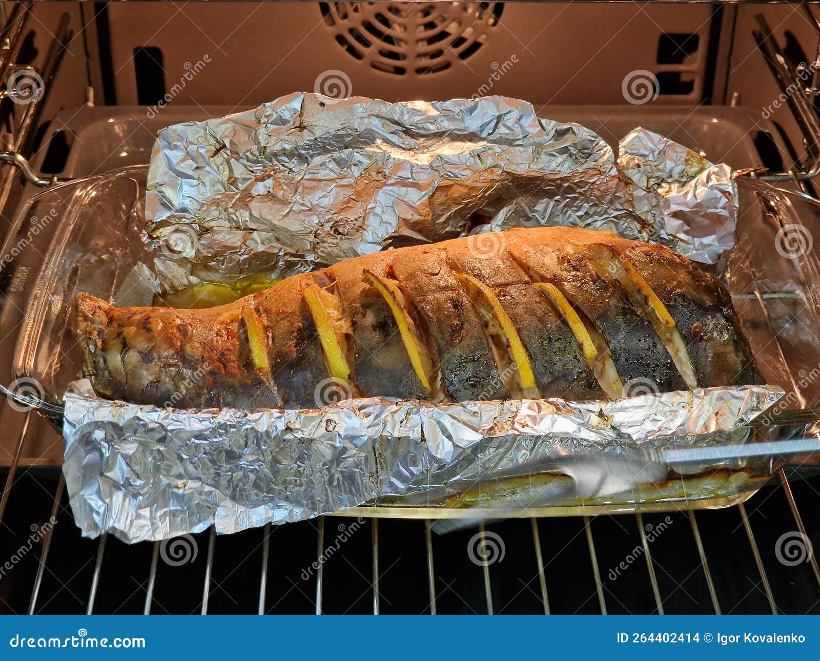 Fish in Foil Baked in the Oven, Food. Stock Photo Image of board