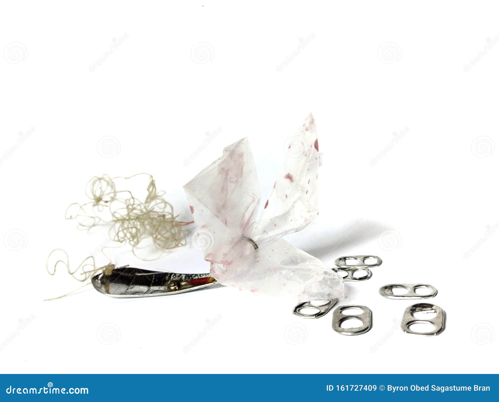 Fish Hook with Marine Litter on White Background. Plastic Bag Stock