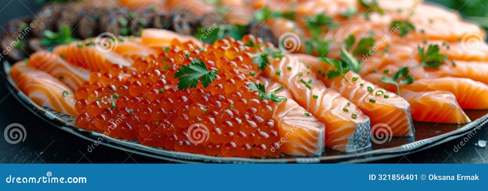 fish platter with light-salted salmon, smoked salmon, red caviar and black bread toast