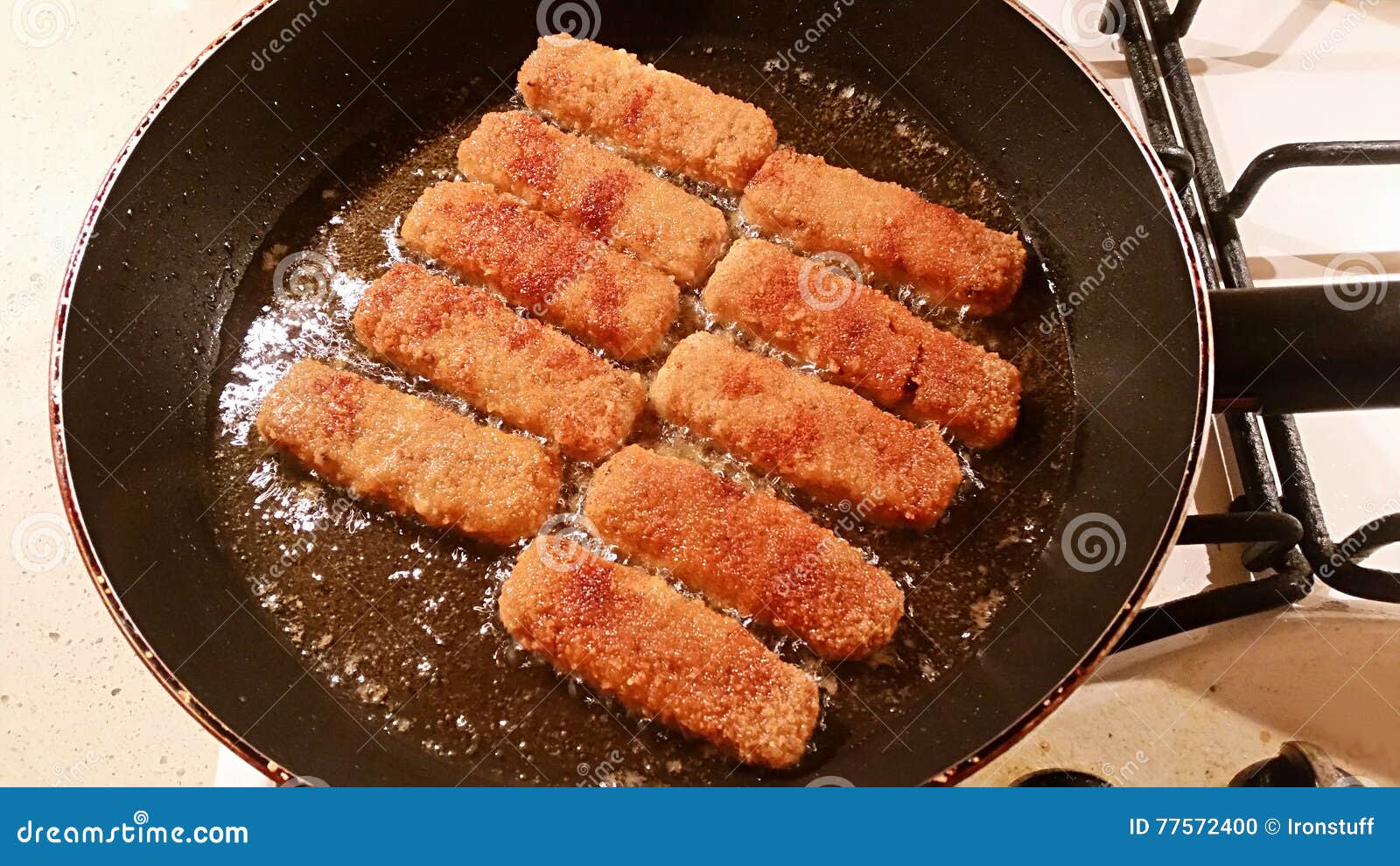 Fish sticks in a pan stock photo. Image of eating, kitchen 77572400