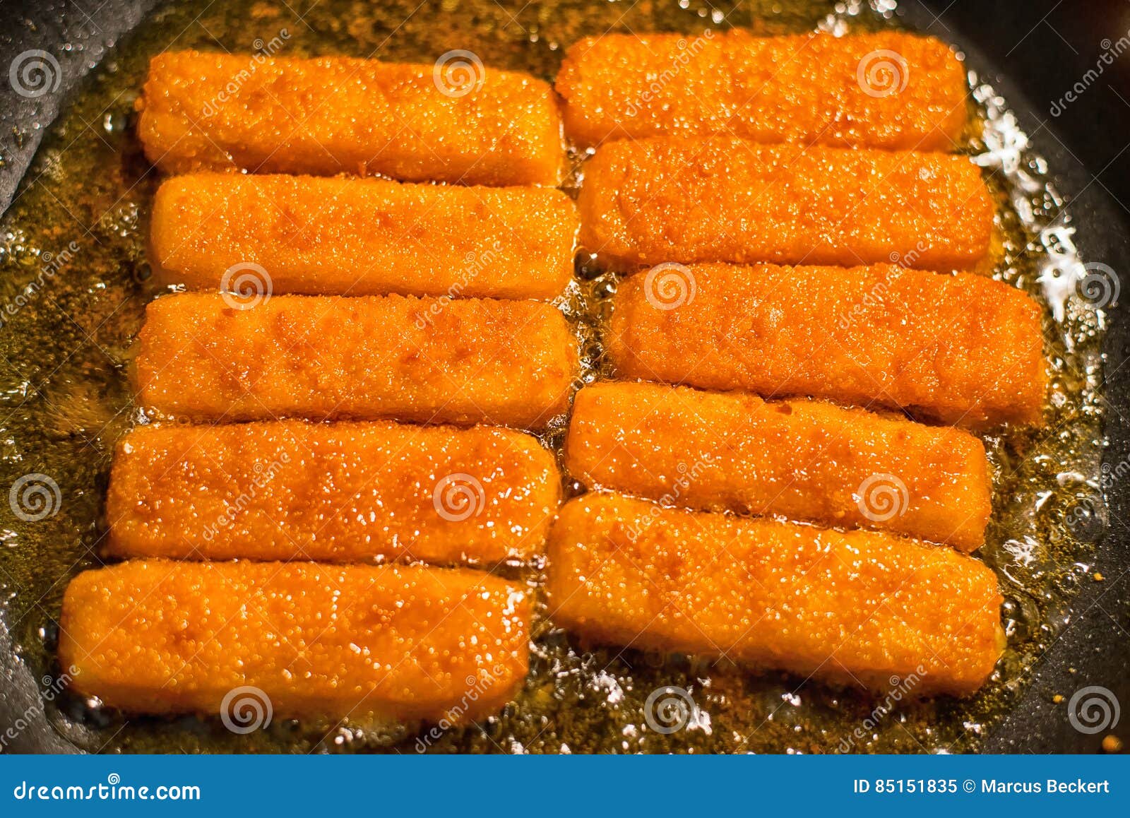Fish sticks in the pan stock image. Image of bubble, fillet 85151835
