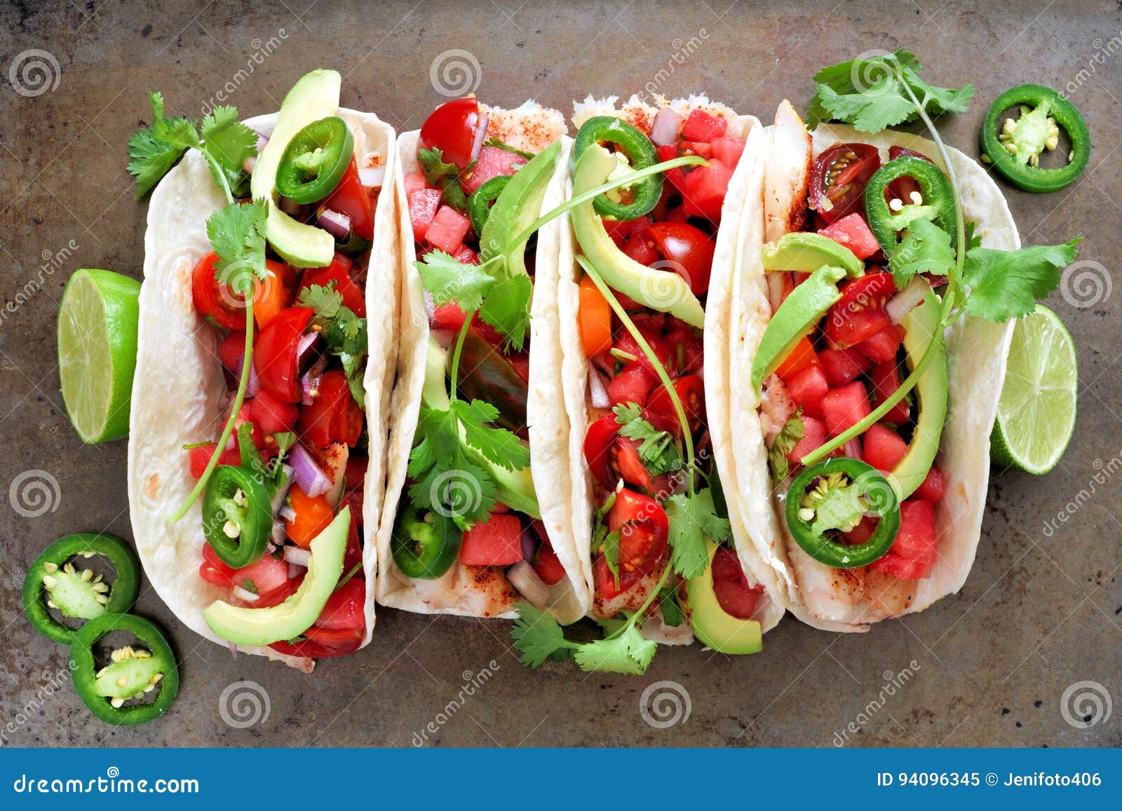 fish tacos with watermelon salsa and avocados, on metallic background
