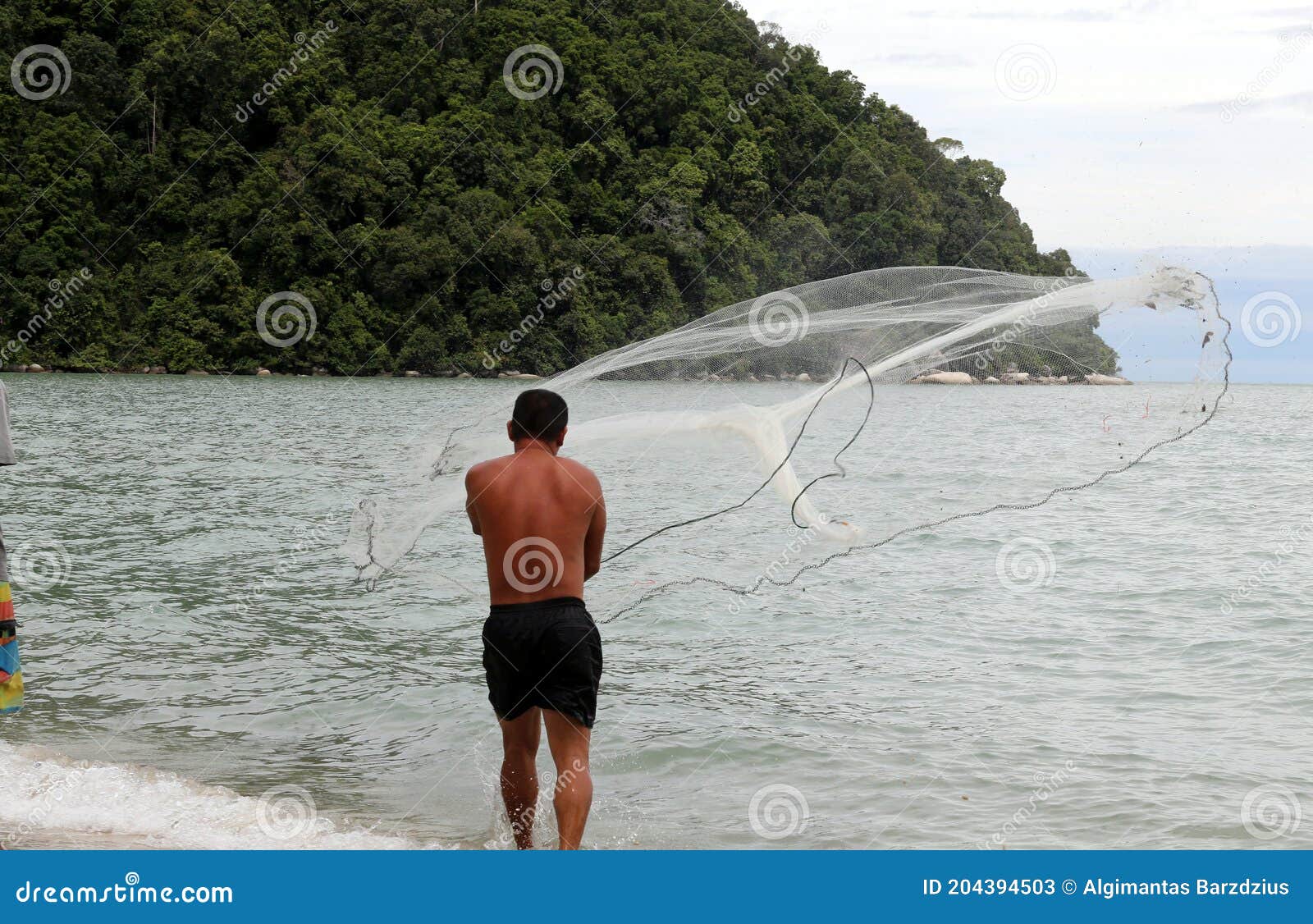 Fisher Man Throwing Fishing Net for Catching Fish for Food