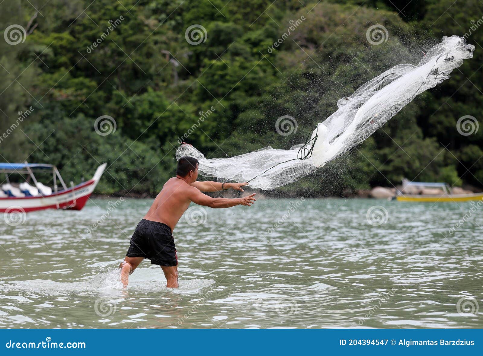 Fisher Man Throwing Fishing Net for Catching Fish for Food
