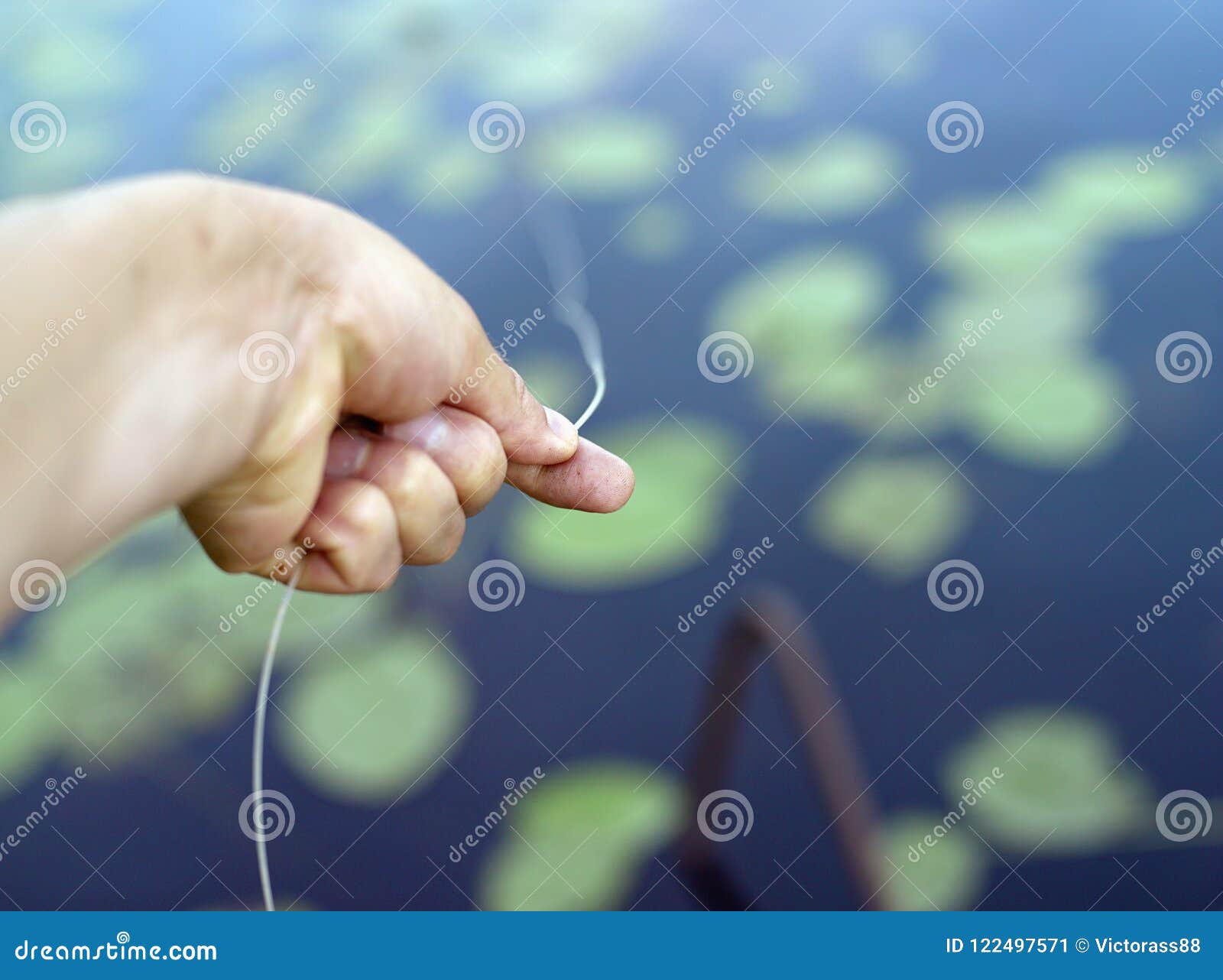 Hand with fishing line stock image. Image of line, hobby - 122497571