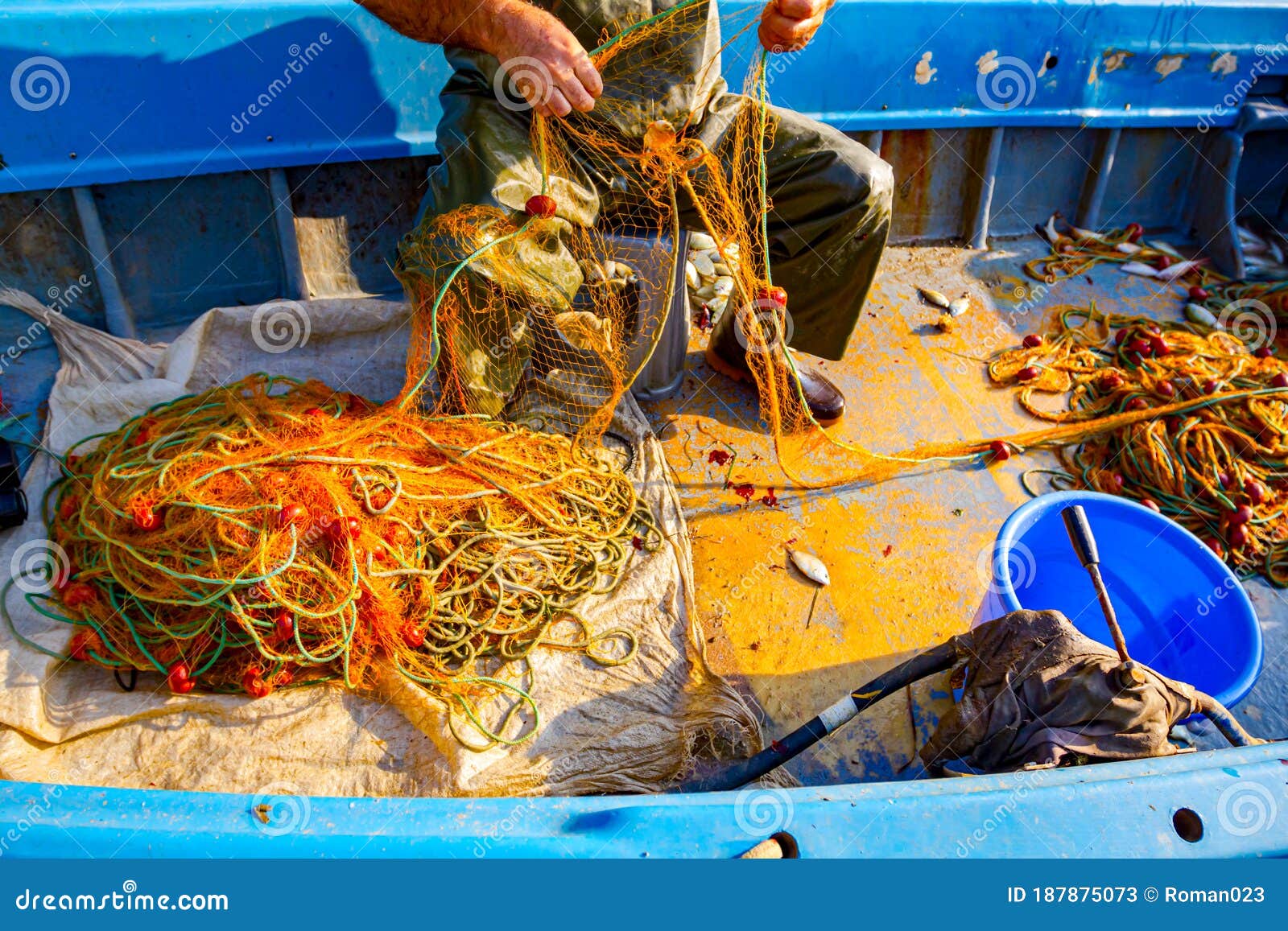 https://thumbs.dreamstime.com/z/fisher-rubber-trousers-boot-siting-his-boat-pile-up-fishing-net-angling-open-sea-fisherman-empty-fish-small-187875073.jpg