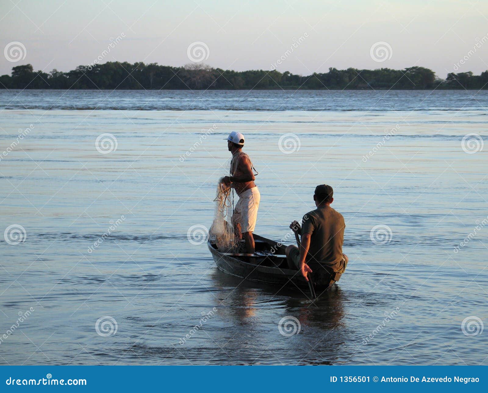 Fisherman in the canoe stock image. Image of fish, work 1356501