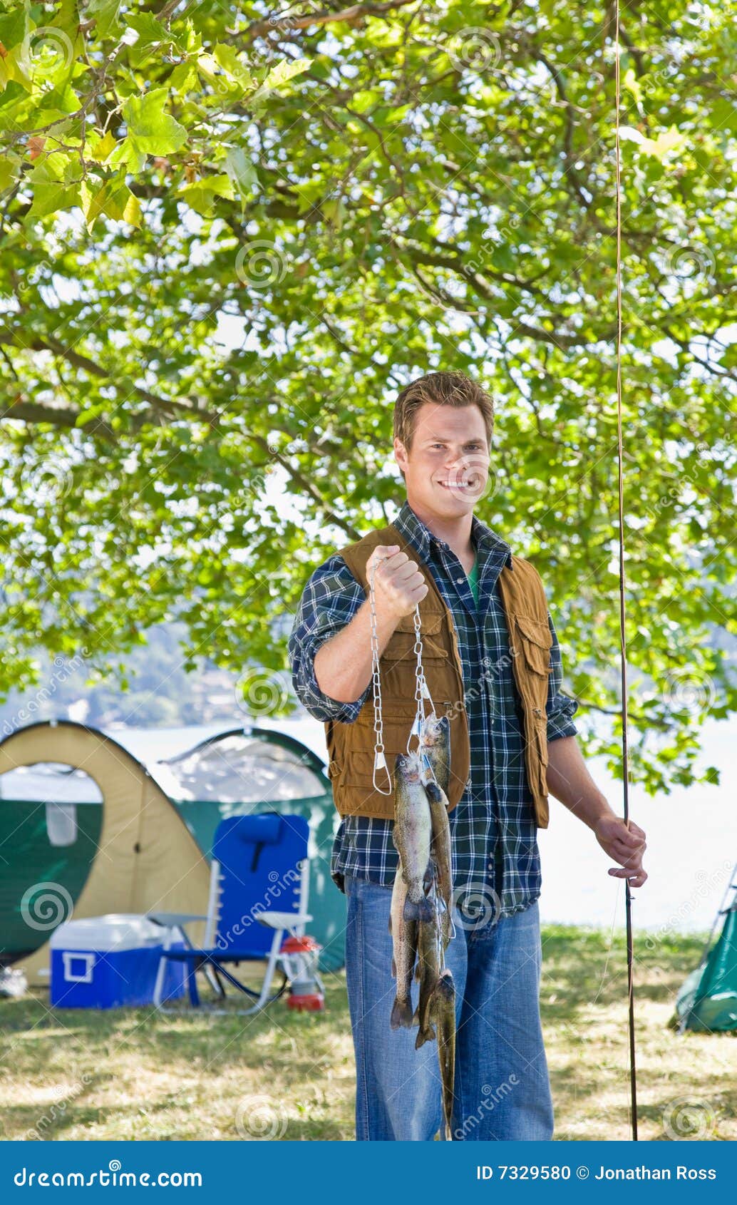Fisherman carrying fish stock photo. Image of male, animals 7329580