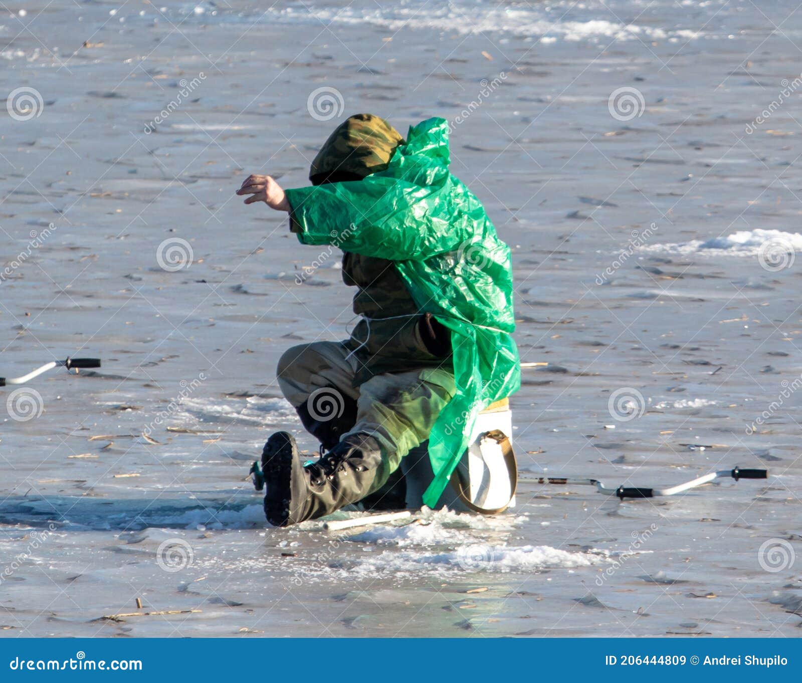 A Fisherman Catches Fish on the Ice of the Lake Stock Image Image of
