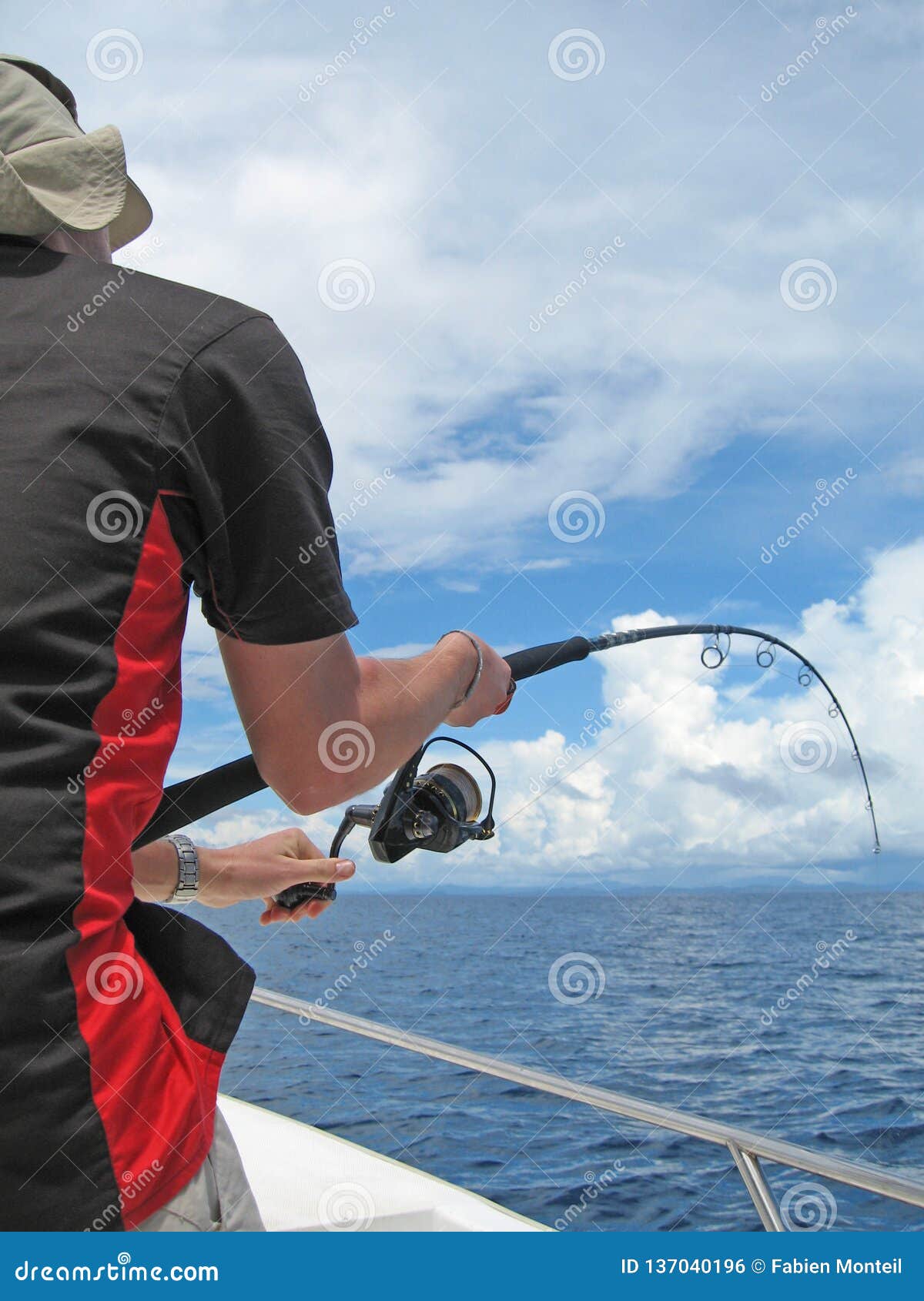 Fisherman fighting a fish stock photo. Image of game - 137040196