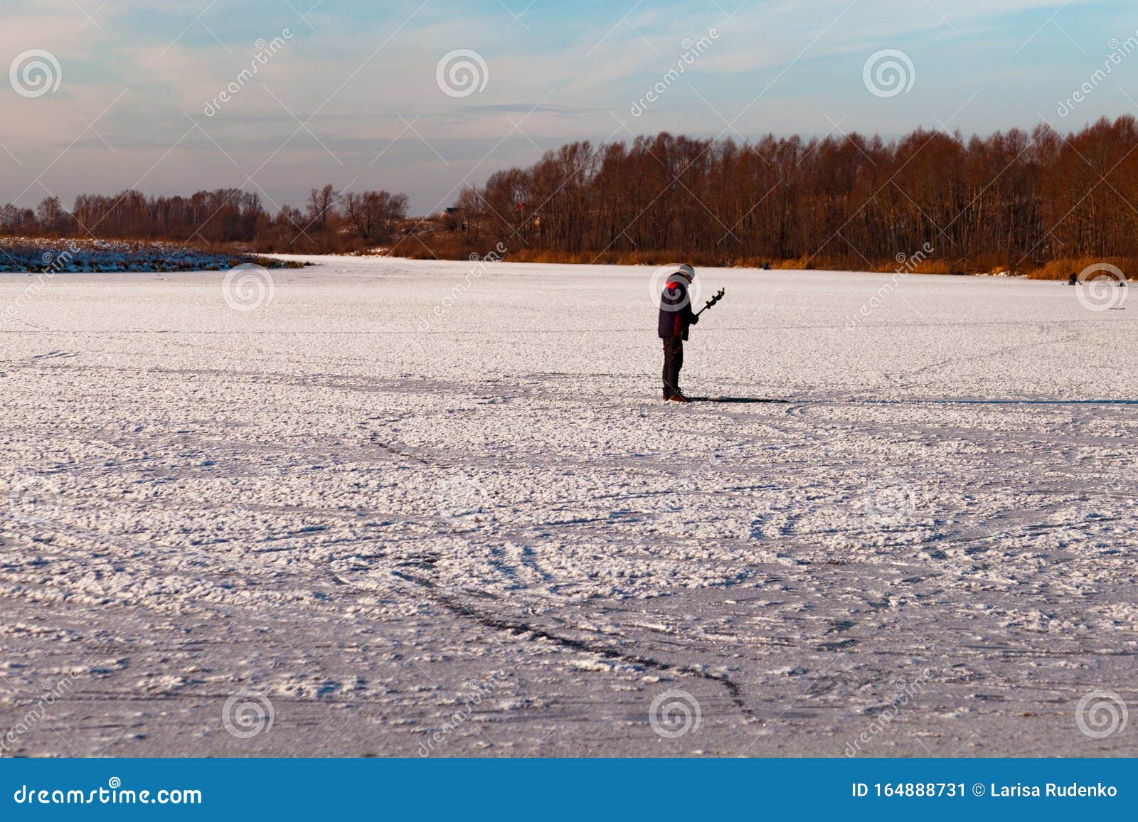 Download Fisherman Figure On Little, Natural, Frozen Winter River ...
