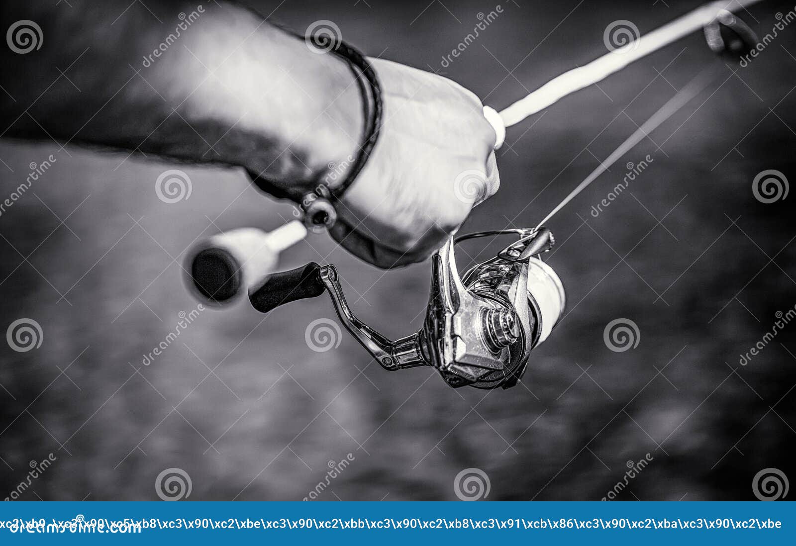 Fisherman Hand Holding Fishing Rod with Reel. Fishing Reel. Fishing Rod  with Aluminum Body Spool. Fishing Gear. Fish Stock Photo - Image of  equipment, hand: 259461680