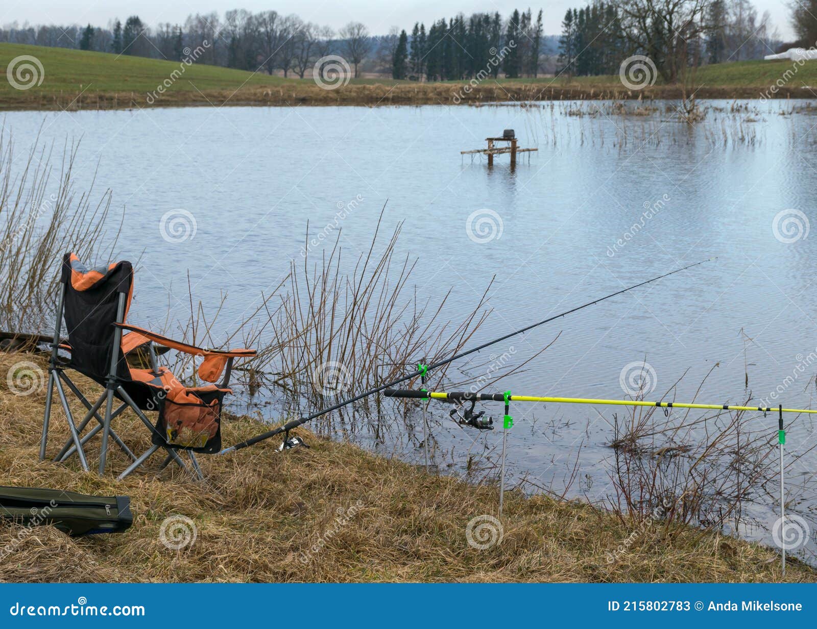 A Fisherman`s Chair and Fishing Rods on the Lake Shore, Fishing As