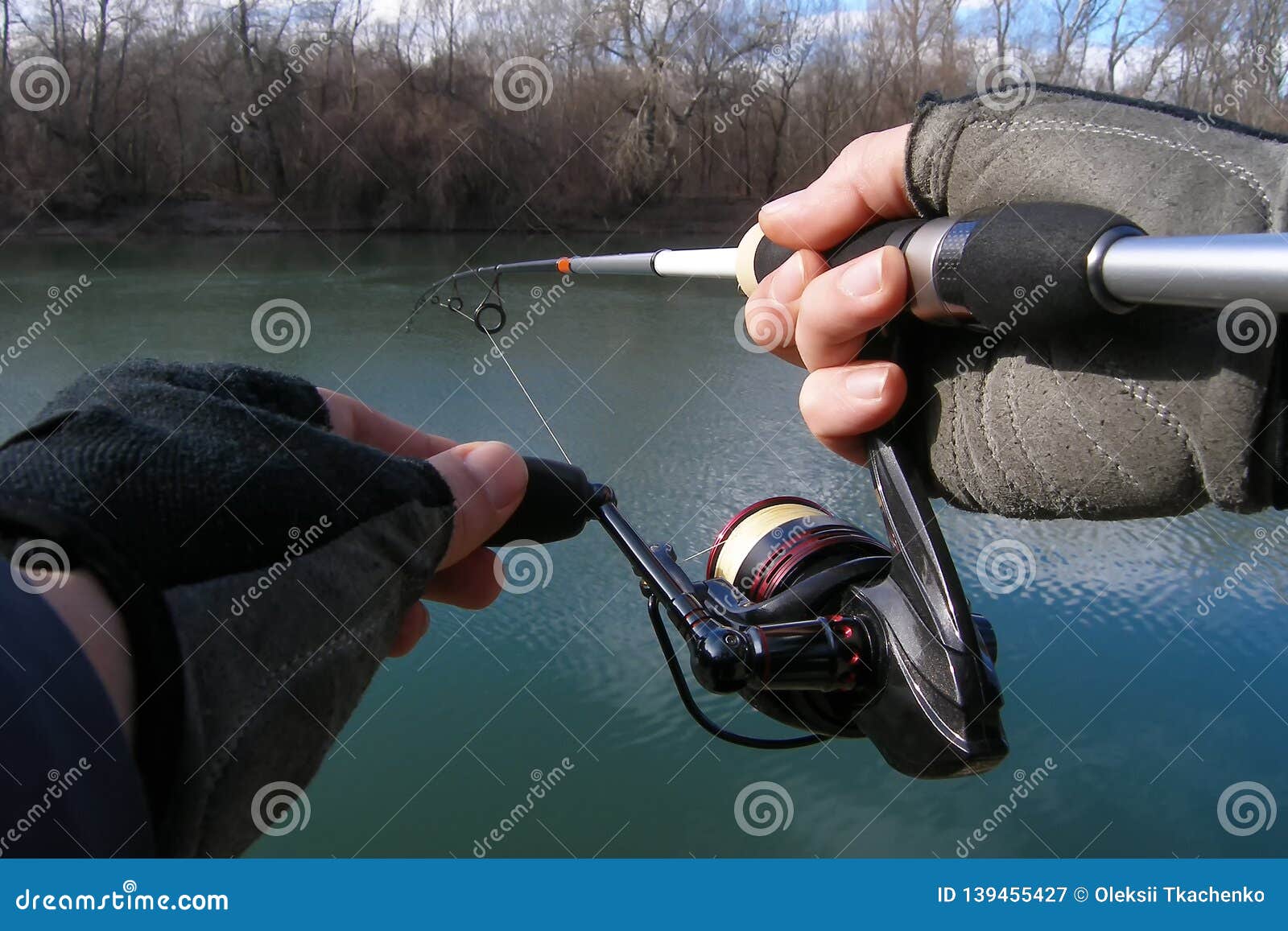 Fisherman`s Hands Hold a Spinning Rod. Stock Image - Image of