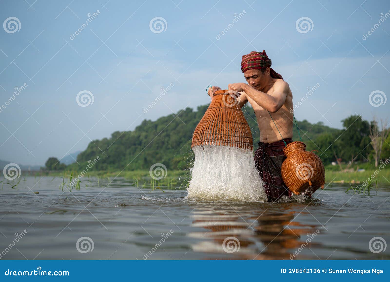 Fisherman Using Traditional Fishing Gear To Catch Fish for Cooking